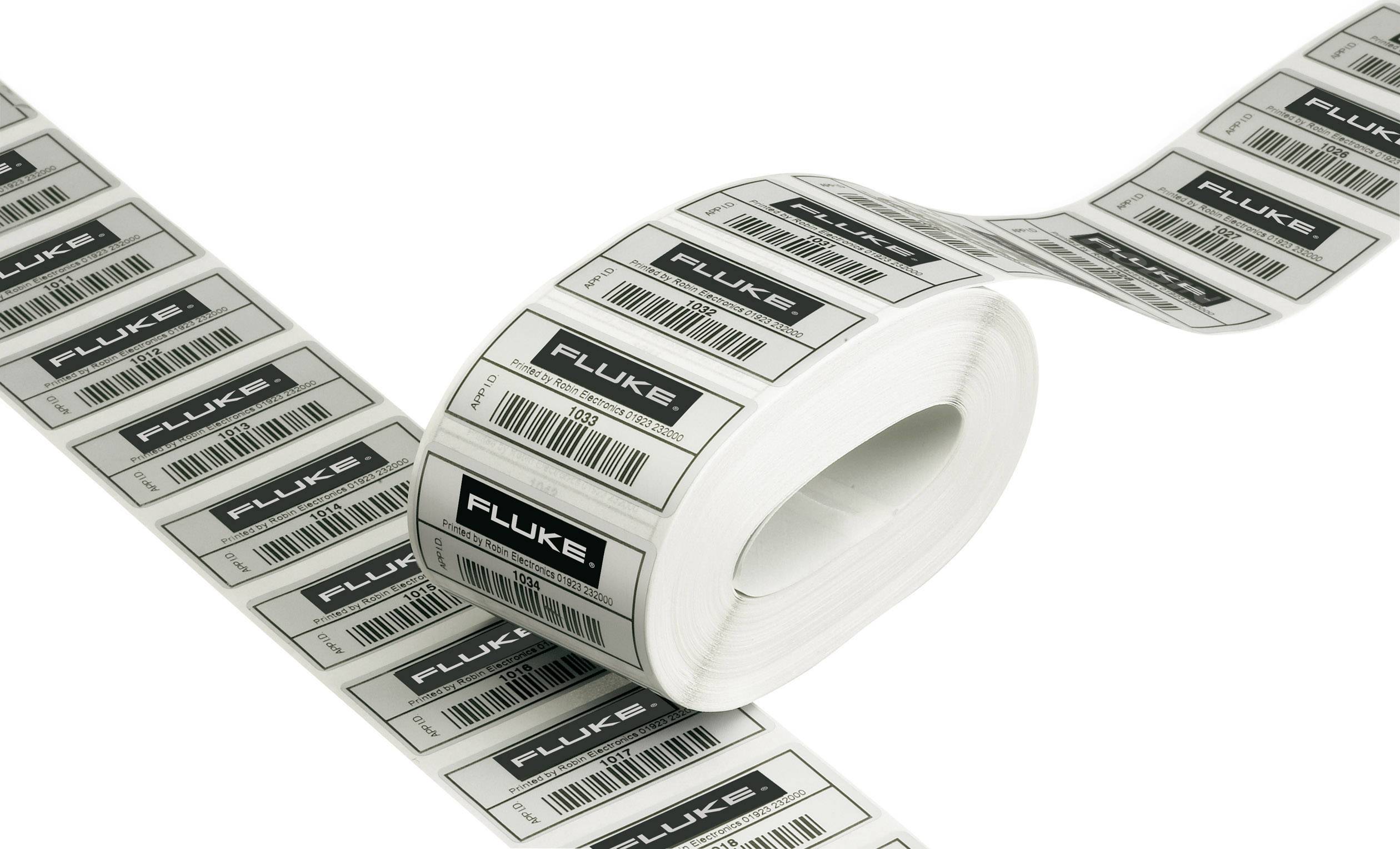 Un rouleau d'étiquettes portant l'inscription 'FLUKE' et des codes-barres imprimés en rangée sur un fond blanc.