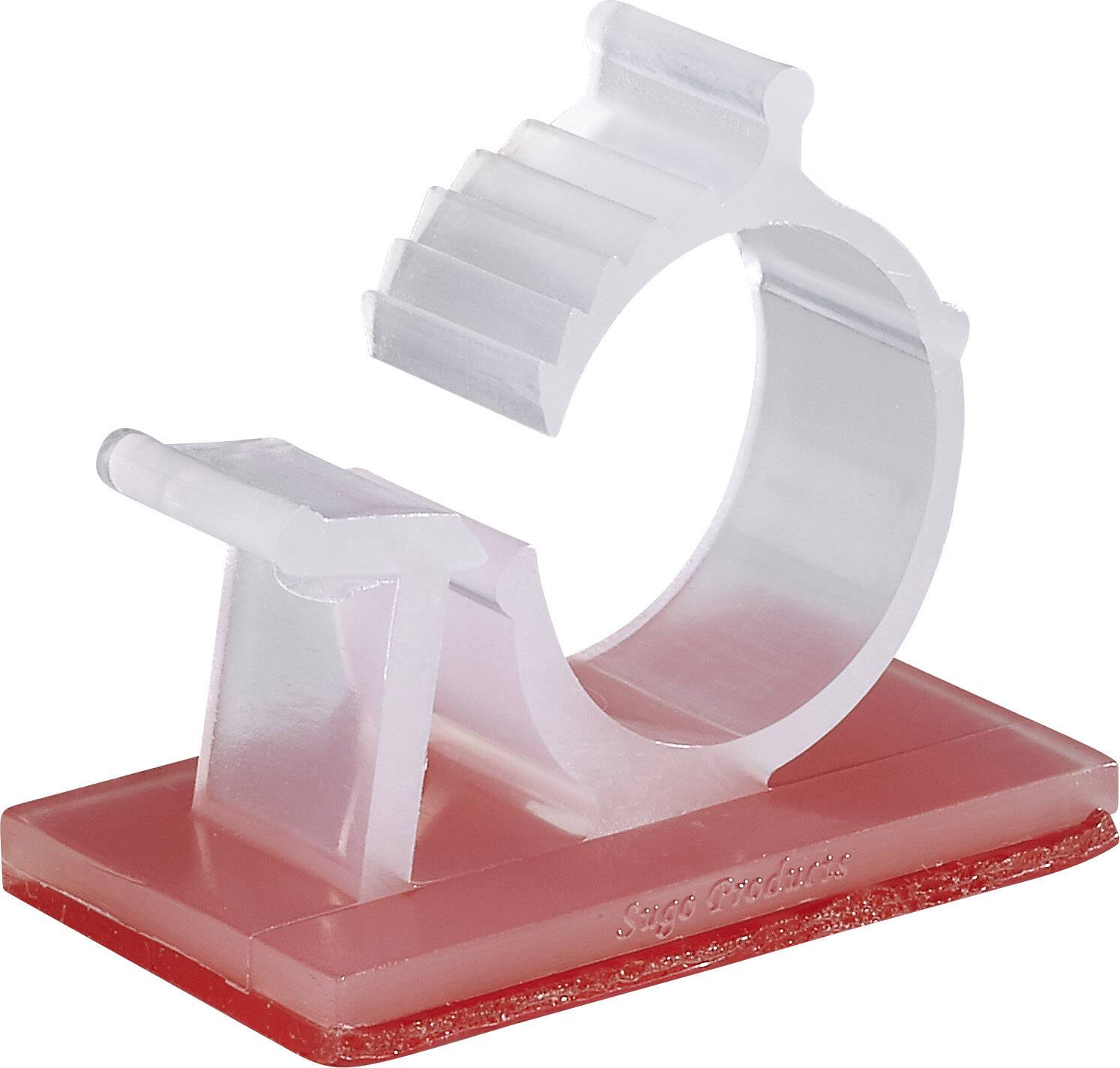 Un anneau en plastique transparent avec un motif dentelé sur un socle rectangulaire rouge.