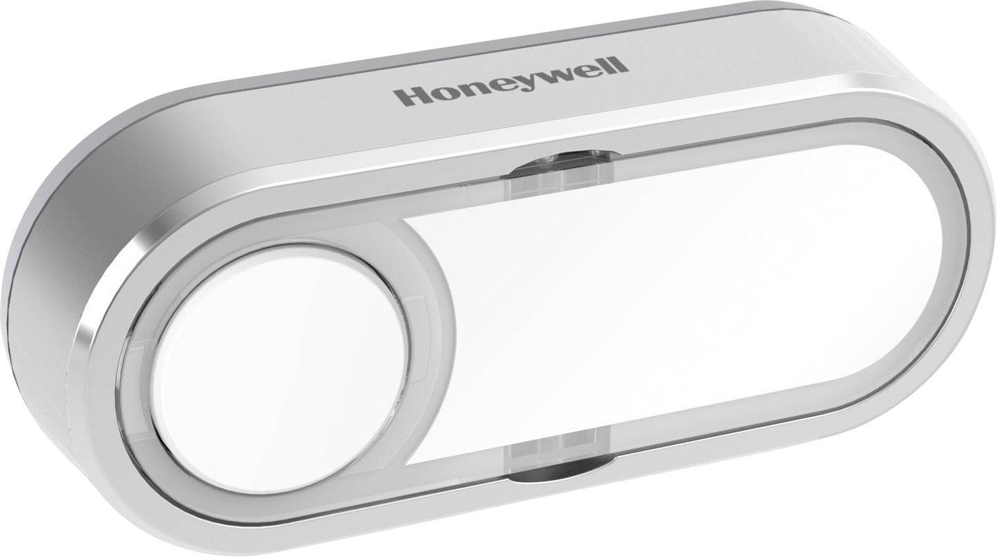 Appareil allongé de couleur argentée avec un bouton circulaire à gauche, portant le nom de marque 'Honeywell'.