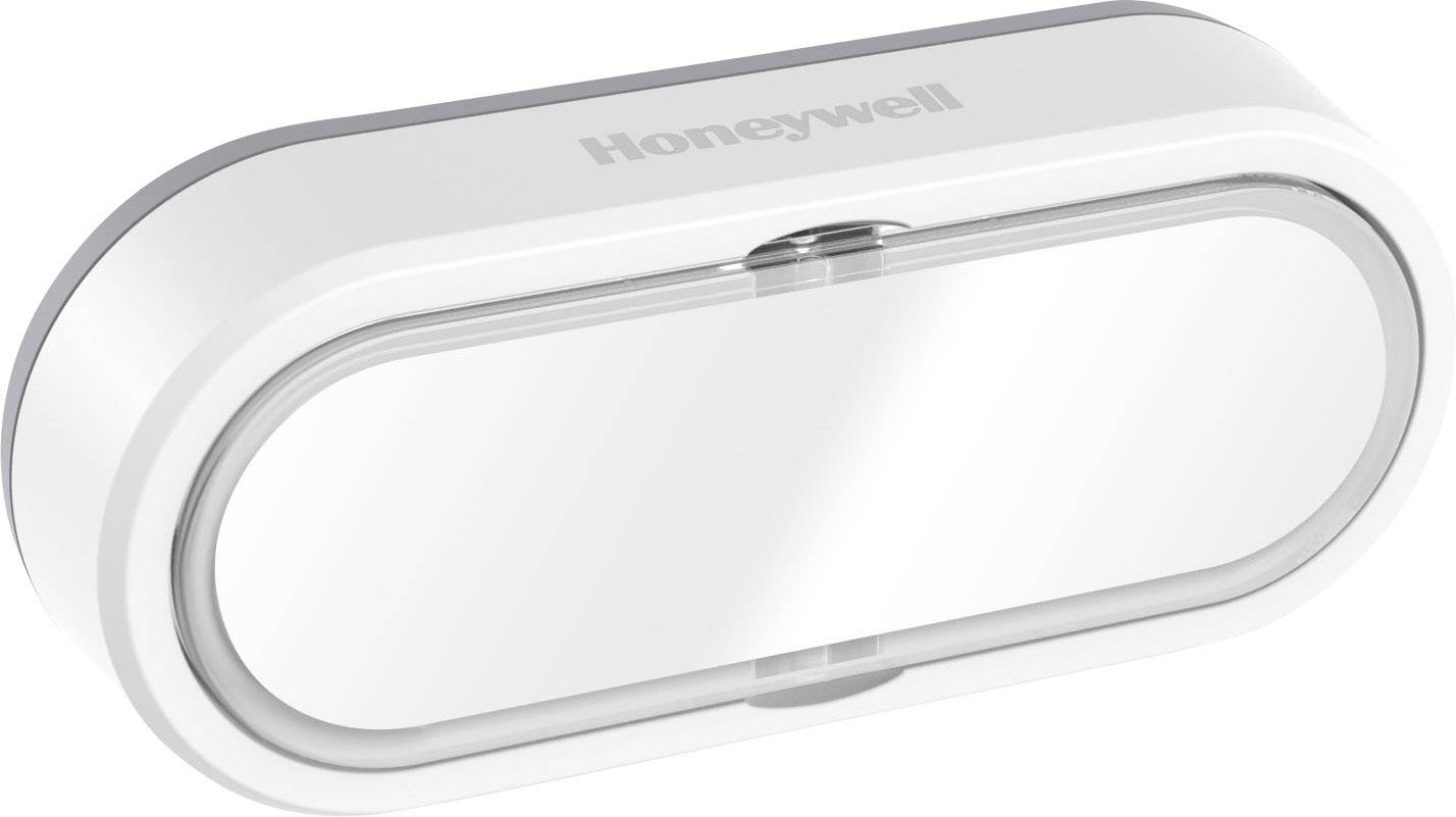 Un capteur de porte ou de fenêtre ovale blanc de Honeywell pour surveiller les ouvertures et les fermetures.