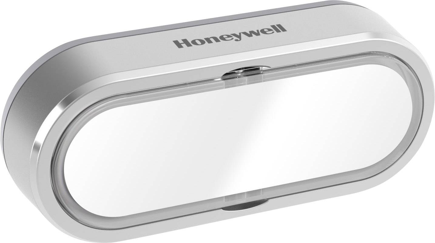 Un distributeur de mouchoirs ovale couleur argent de Honeywell avec un couvercle transparent.