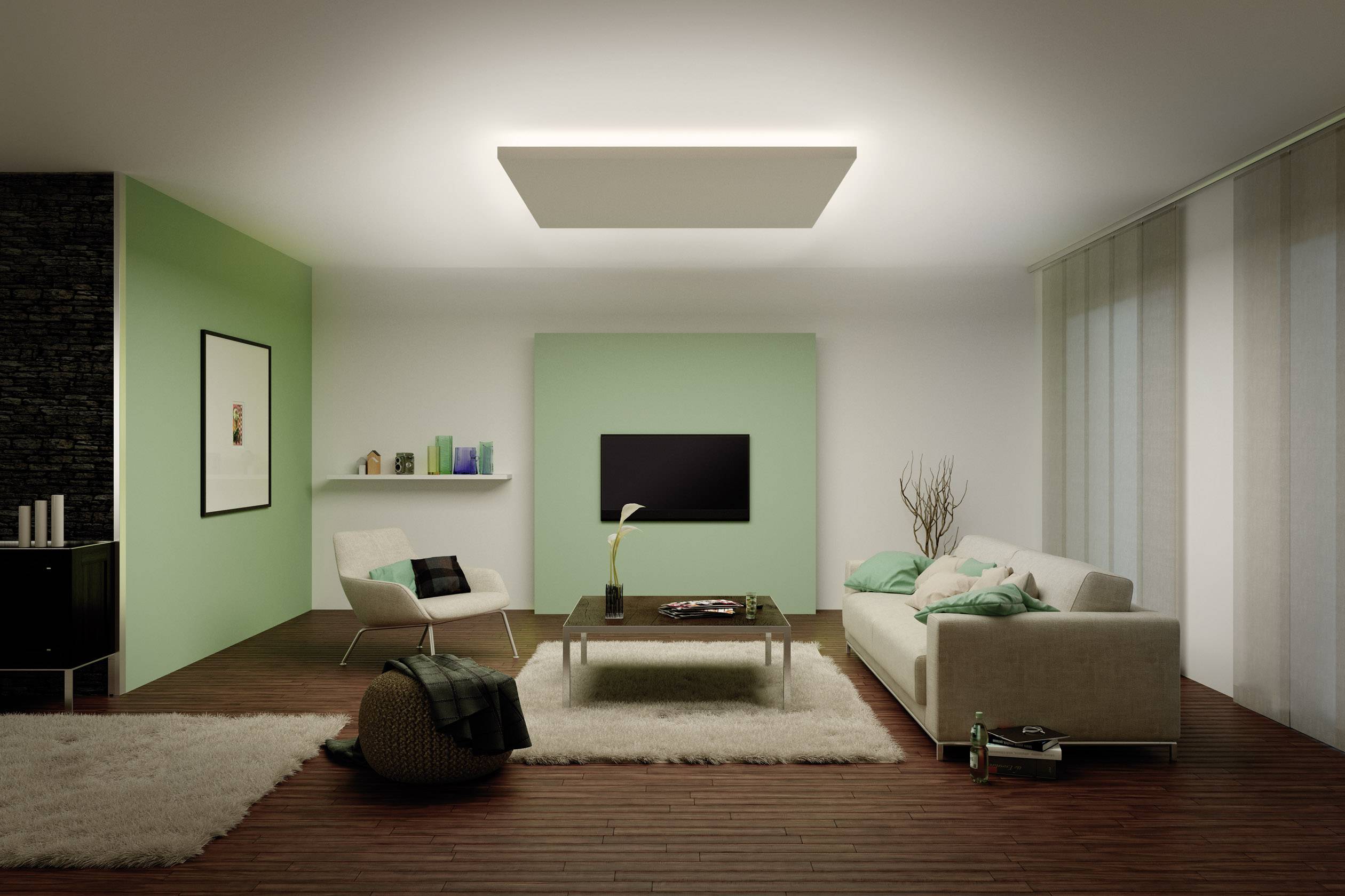 Un salon moderne avec un canapé blanc, un accent vert sur le mur, une télévision à écran plat, un tapis et des coussins décoratifs.