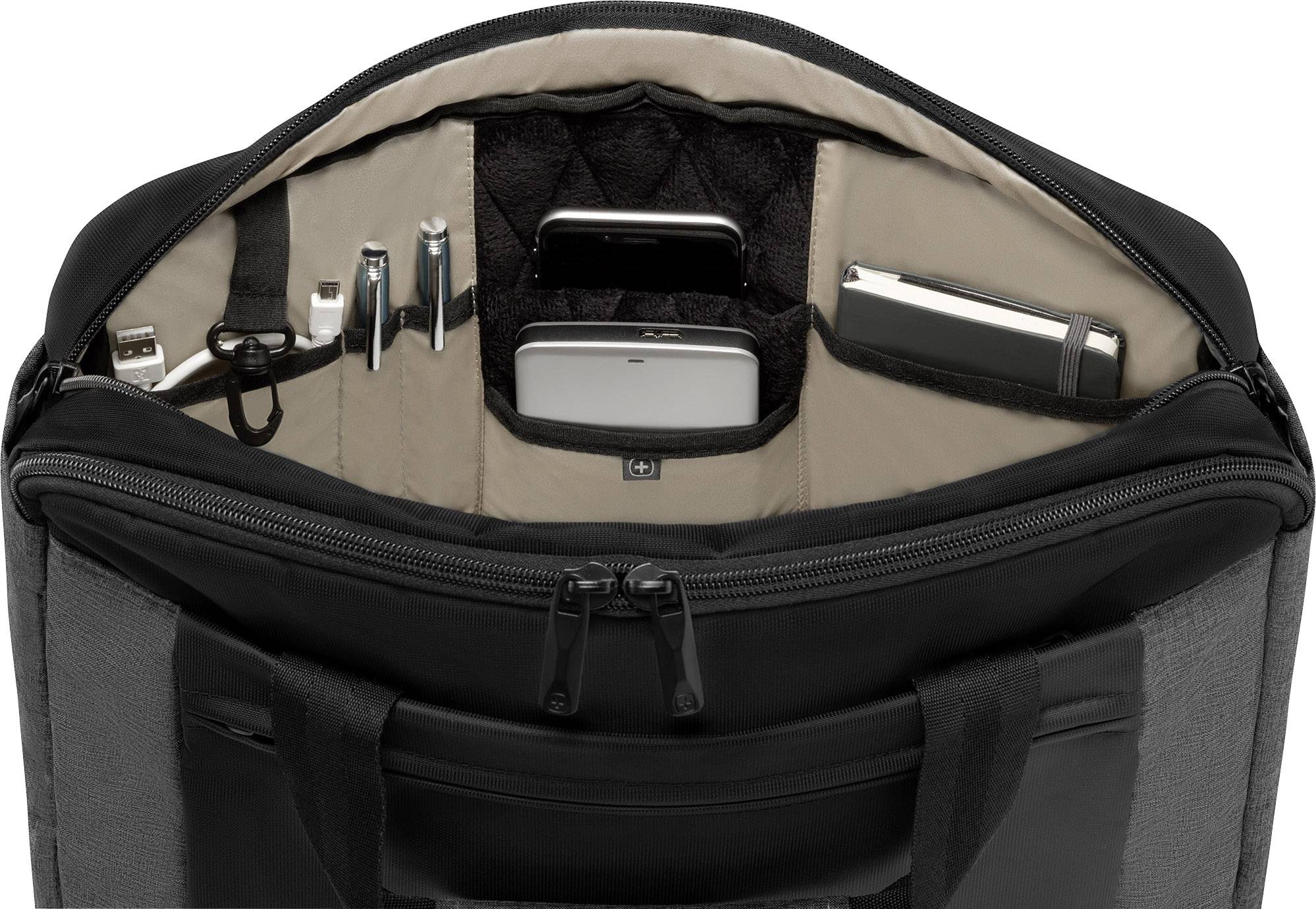 Sacoche d'ordinateur portable ouverte, montrant des compartiments avec des câbles, des stylos, un smartphone, un carnet de notes et un ordinateur portable.