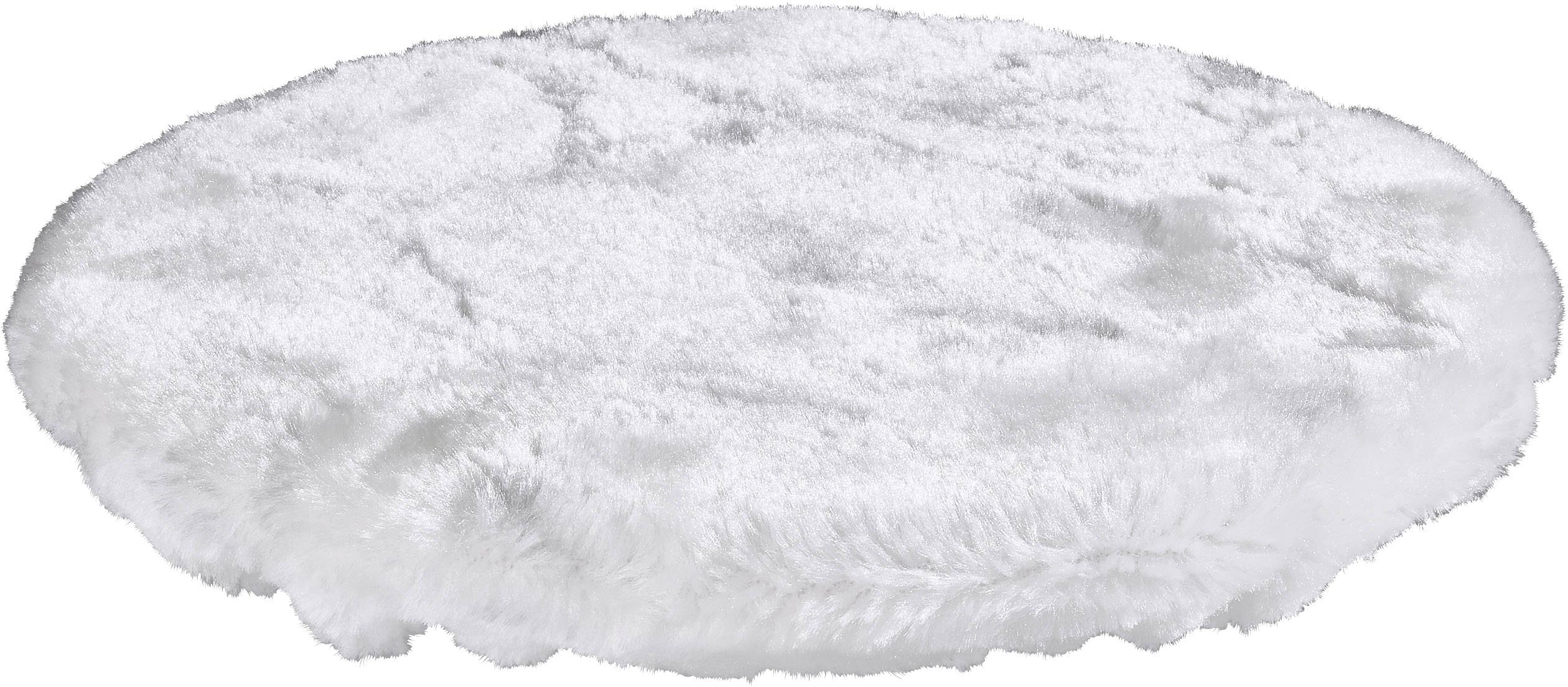 Un tapis rond, duveteux et blanc est posé à plat sur le sol.