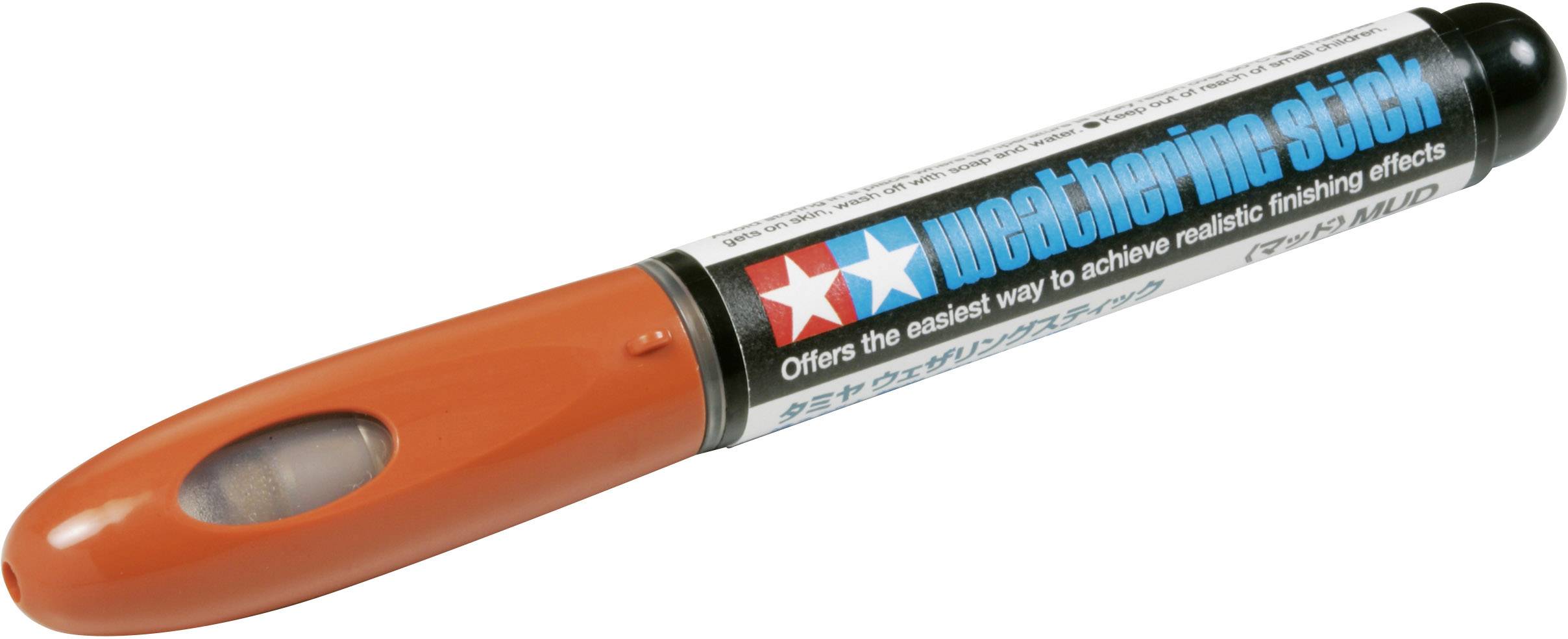 Un marqueur de weathering orange et noir de Tamiya portant l'inscription 'weathering stick'.
