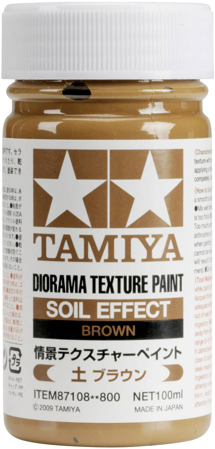 Illustration d'un pot de peinture texturée Tamiya Diorama, couleur 'Effet Terre Brune', 100 ml. Contient un étiquetage en japonais et en anglais.