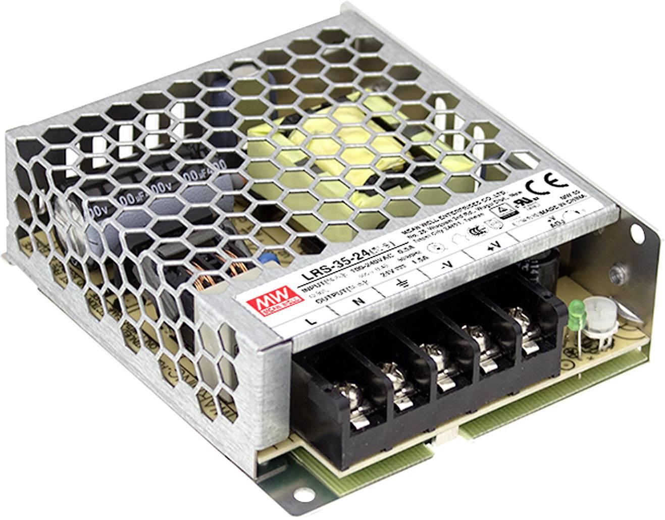 Bloc d'alimentation métallique avec grille hexagonale et connexions enfichables. Autocollant avec informations sur le modèle et symboles de sécurité.