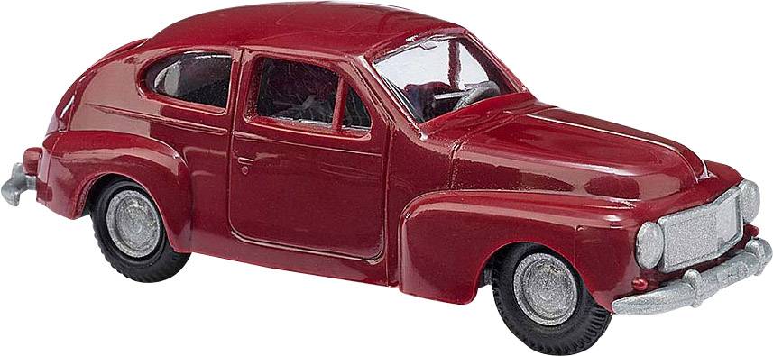 Petite voiture miniature en rouge avec des phares ronds et des pare-chocs chromés. Elle présente un design classique et compact.