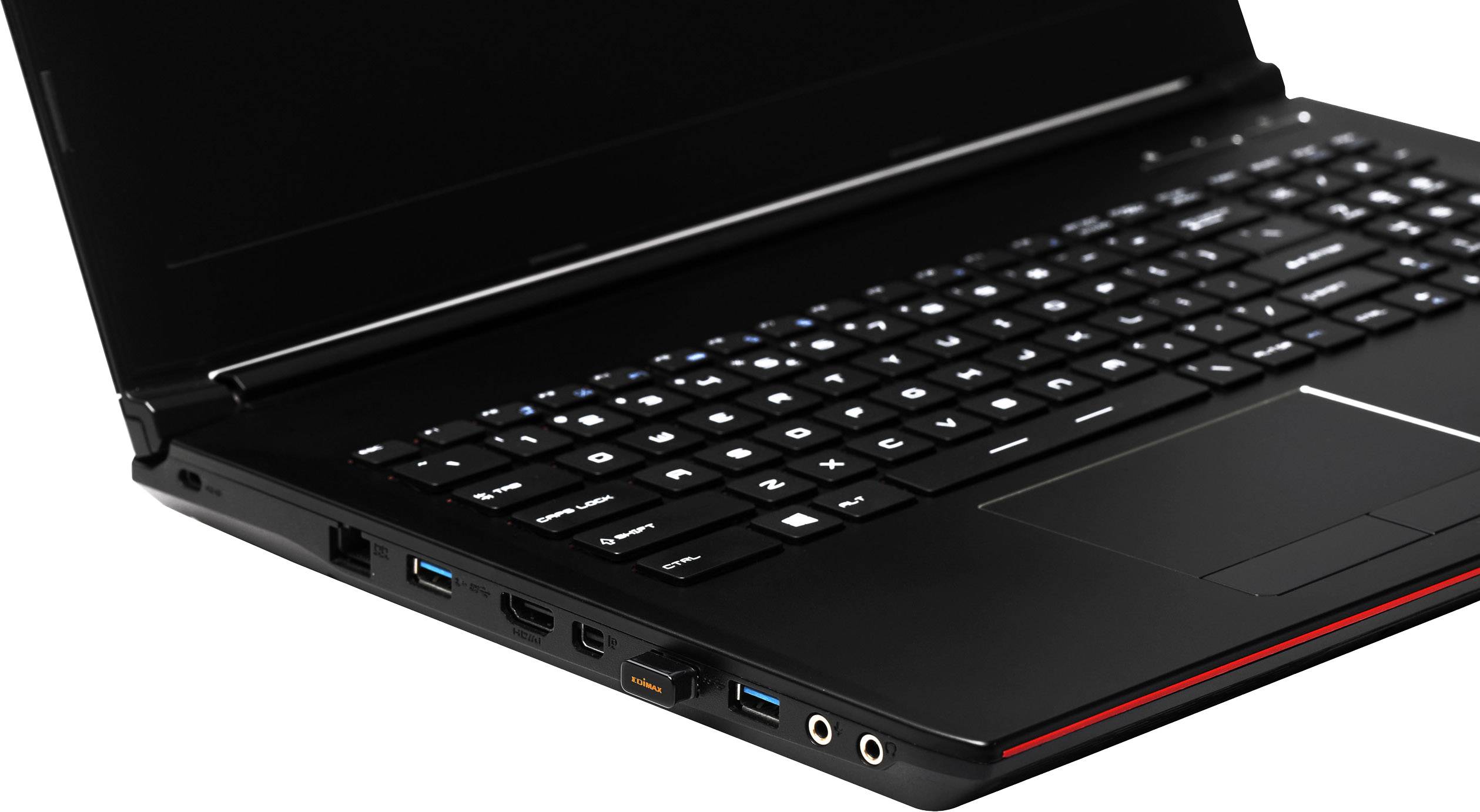Un ordinateur portable noir avec un clavier ouvert, présentant différentes connexions sur le côté gauche, notamment des ports USB et HDMI.