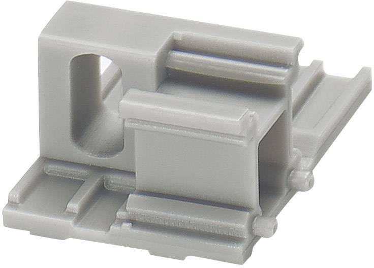 Pièce en plastique grise avec des ouvertures et des rainures, probablement un élément de connexion ou un composant de boîtier, sur fond blanc.