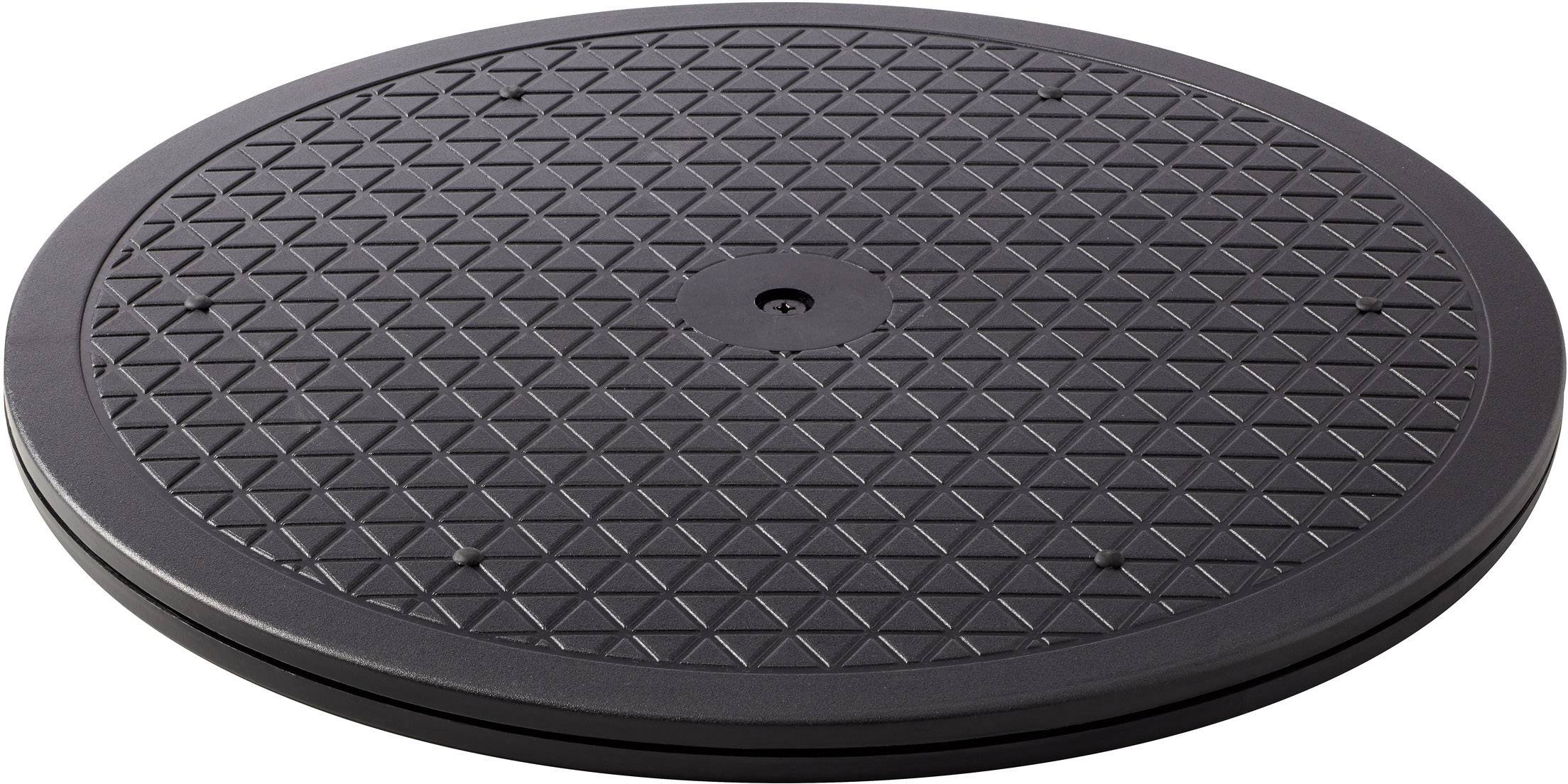 Plateau tournant noir et rond avec un motif en losange, utilisé pour faire tourner des objets, présenté sur un fond blanc.