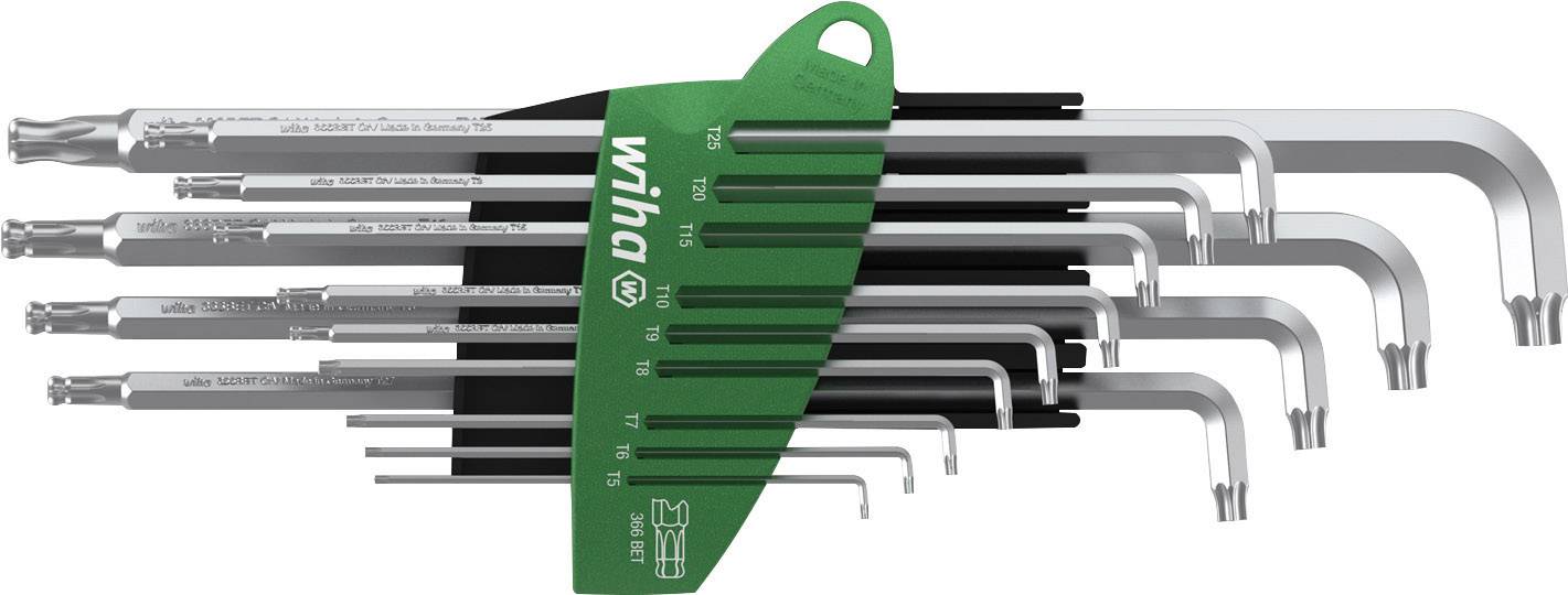 Jeu de huit clés polygonales de différentes tailles, disposées dans un support vert, marqué 'Wiha'.