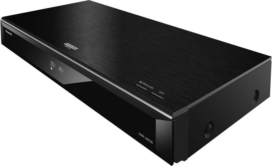 Un lecteur Blu-ray noir est posé sur une table. Des logos de marque sont visibles sur le boîtier. Le design est élégant et moderne.