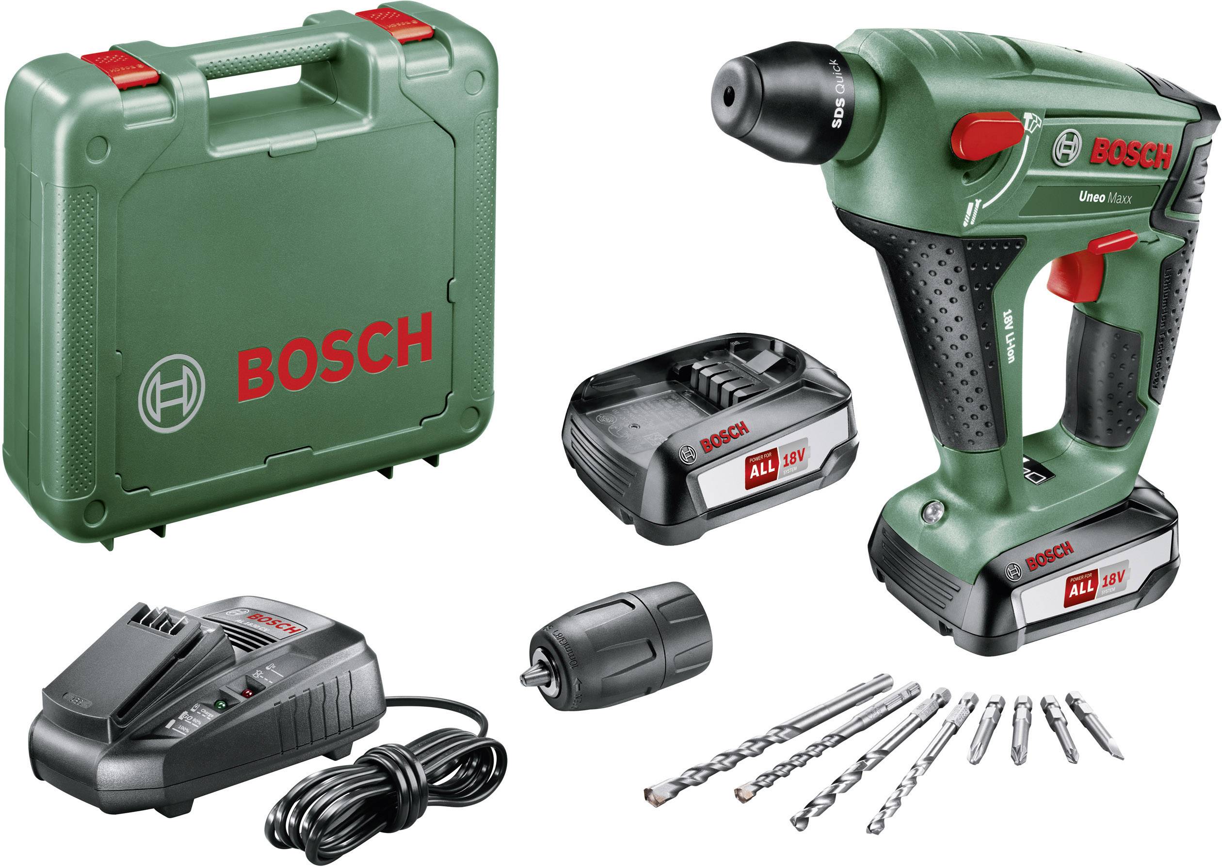 Ensemble de visseuse-perceuse avec visseuse-perceuse Bosch verte, deux batteries, chargeur, embouts de forage et mallette en plastique.
