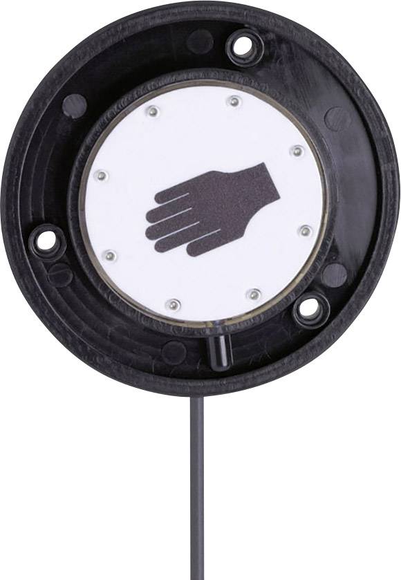 Un capteur rond noir avec un symbole de main au centre, monté sur une surface.