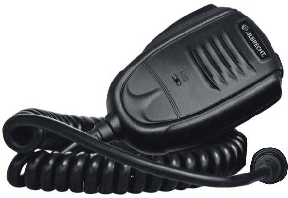 Un microphone à main noir avec un câble ondulé, adapté aux radios, est enroulé et posé sur une surface.