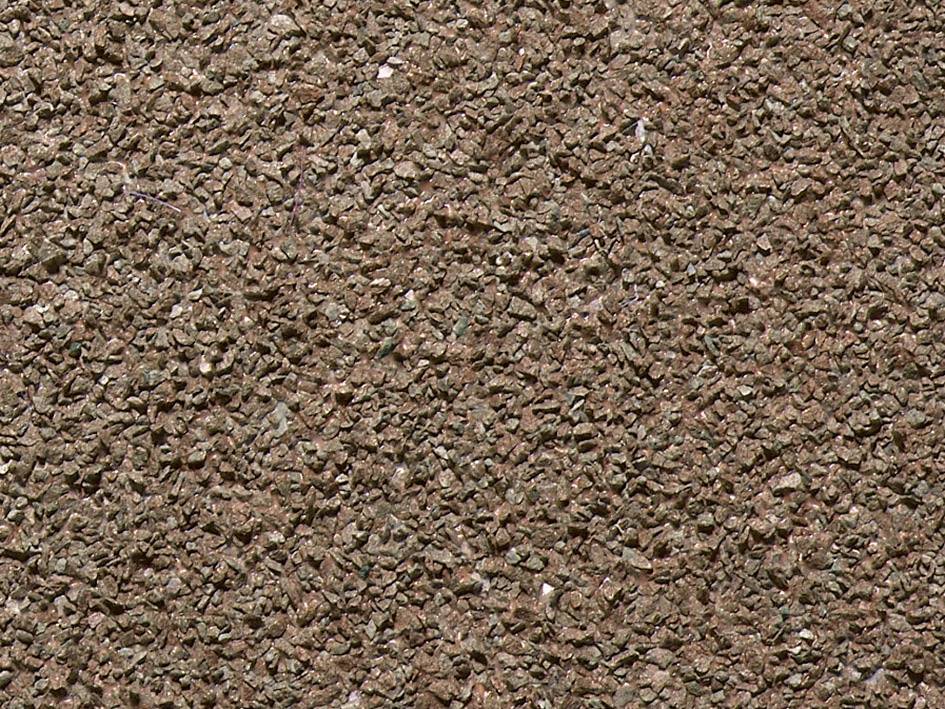 Surface d'asphalte brun granuleux avec une structure grossière, fréquemment utilisée pour les toits extérieurs ou les trottoirs.