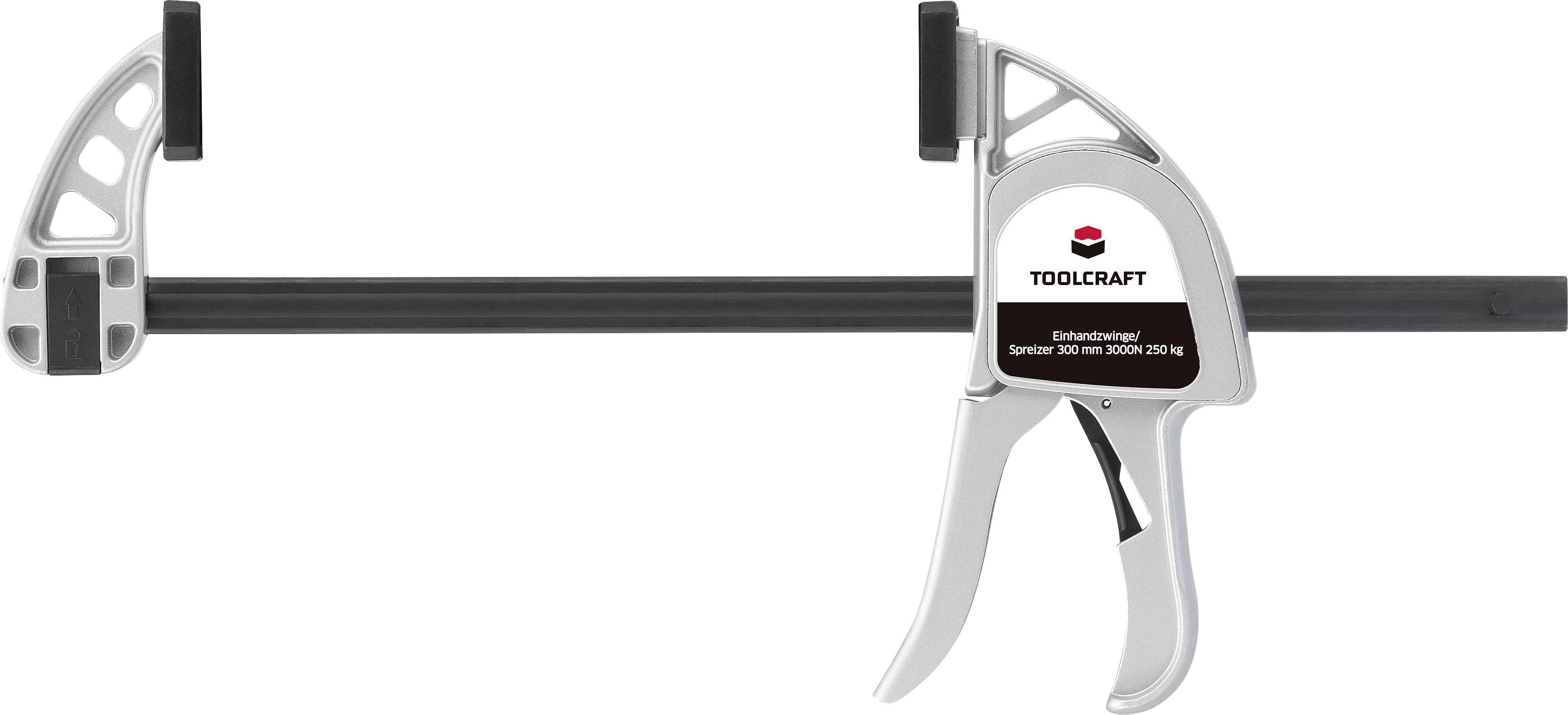 Une pince-étau à une main en argent de la marque TOOLCRAFT avec poignée et rail noirs, adaptée pour des portées de 530 mm.