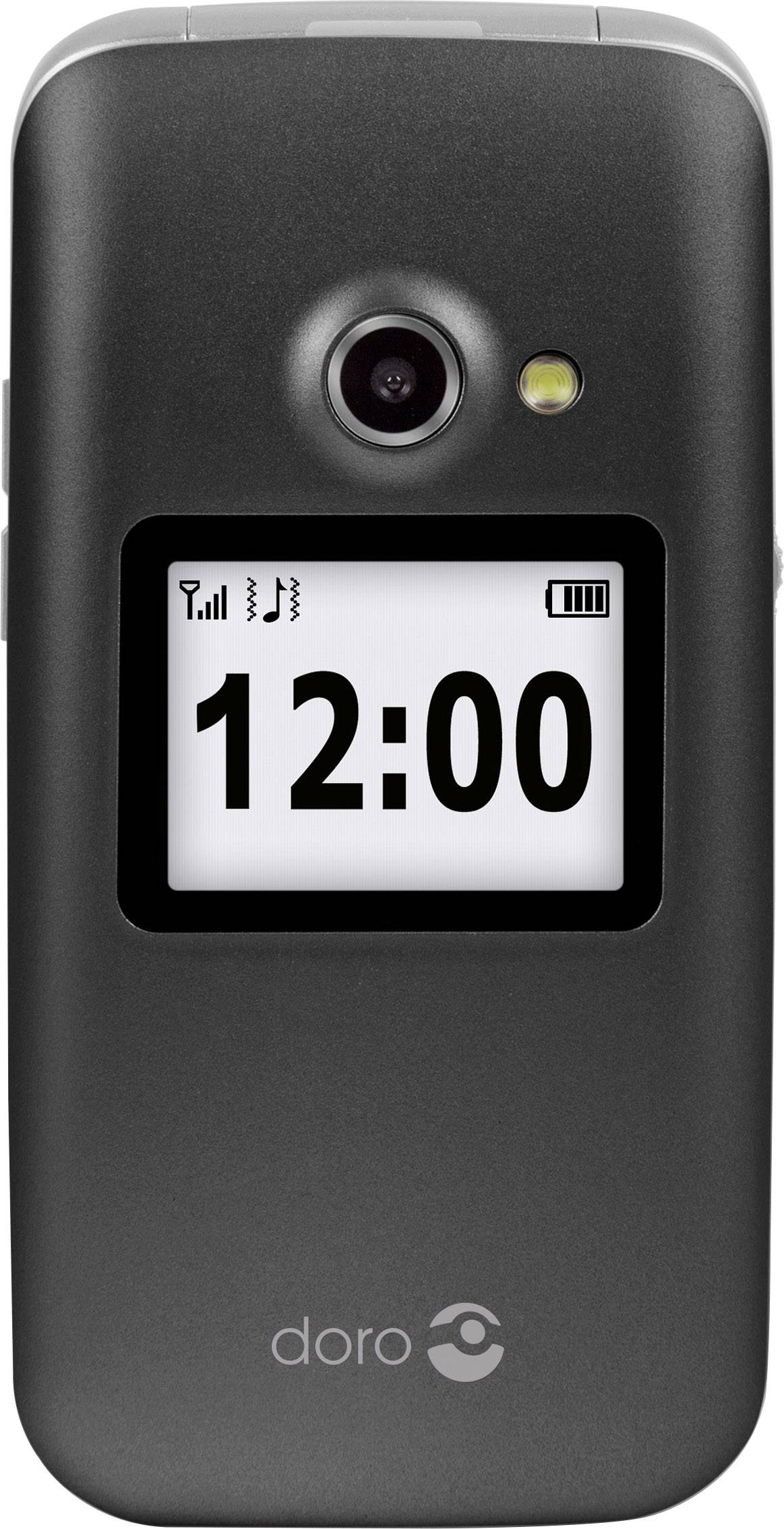 Un téléphone portable compact à clapet en noir avec un grand écran affichant '12:00', surmonté d'un appareil photo avec flash.
