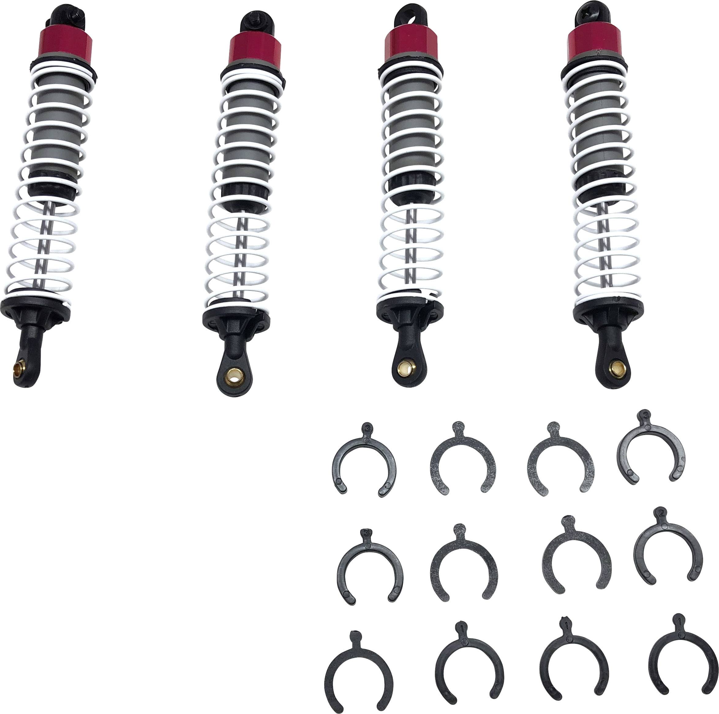 Quatre amortisseurs avec ressorts et accessoires, tels que joints et clips, disposés sur un fond blanc.