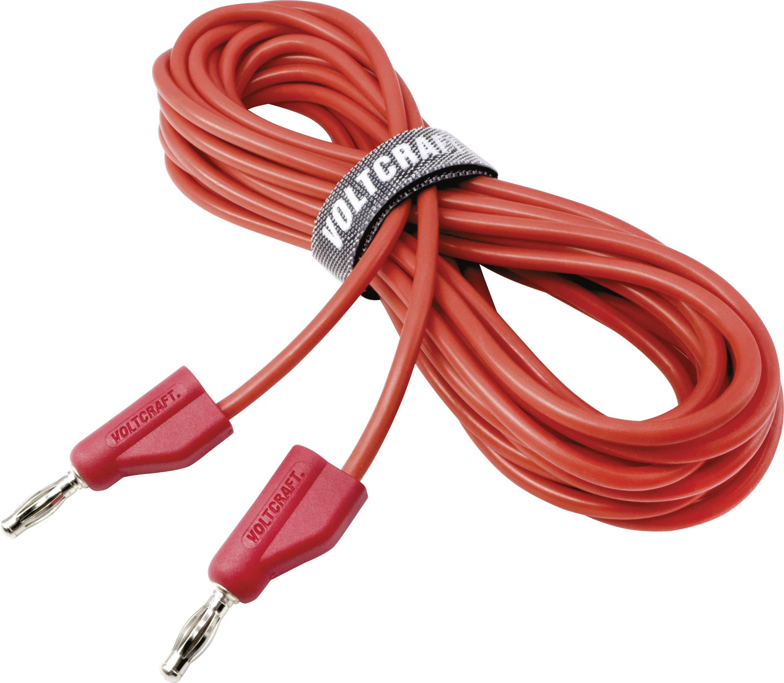 Câble de connexion rouge avec deux pinces métalliques aux extrémités, maintenu par une attache auto-agrippante grise portant l'inscription 'Voltcraft'.