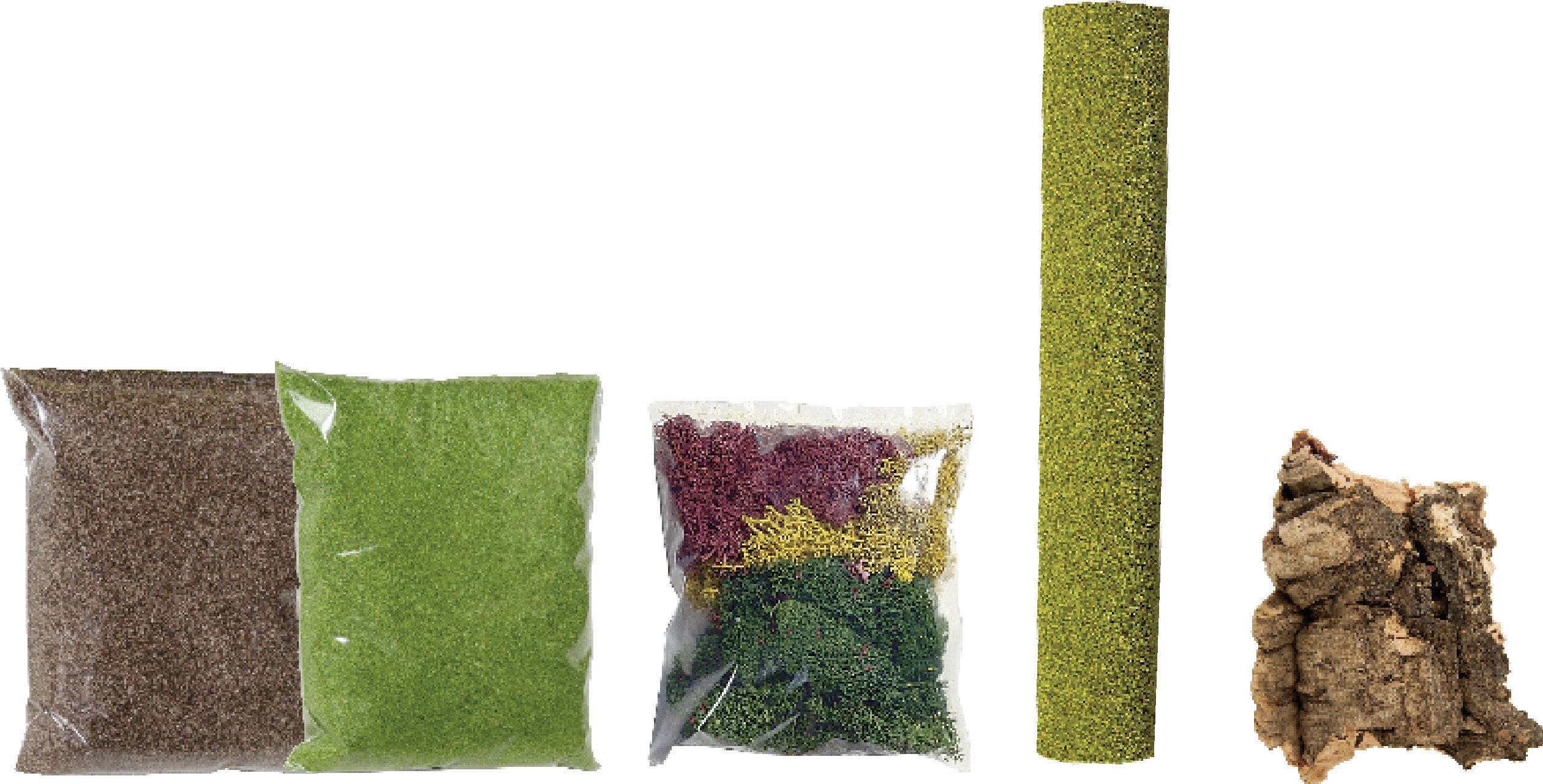 L'image montre différents emballages de matériel de loisirs créatifs : des matériaux à saupoudrer marron, vert, multicolores, un rouleau vert et un morceau d'écorce.