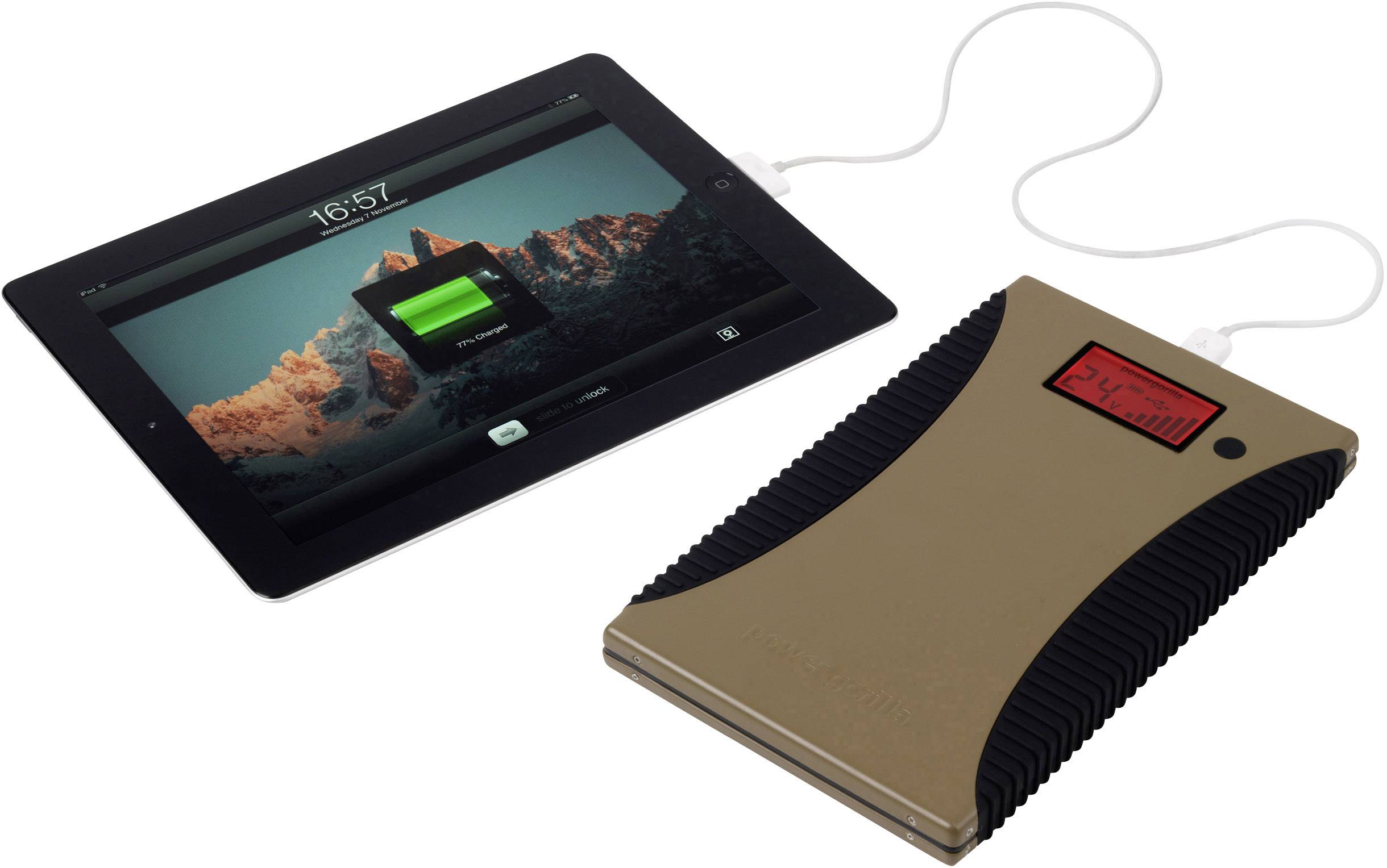 Tablette et batterie externe connectées, la tablette affiche un niveau de charge de 74%, paysage montagneux à l'écran en arrière-plan.