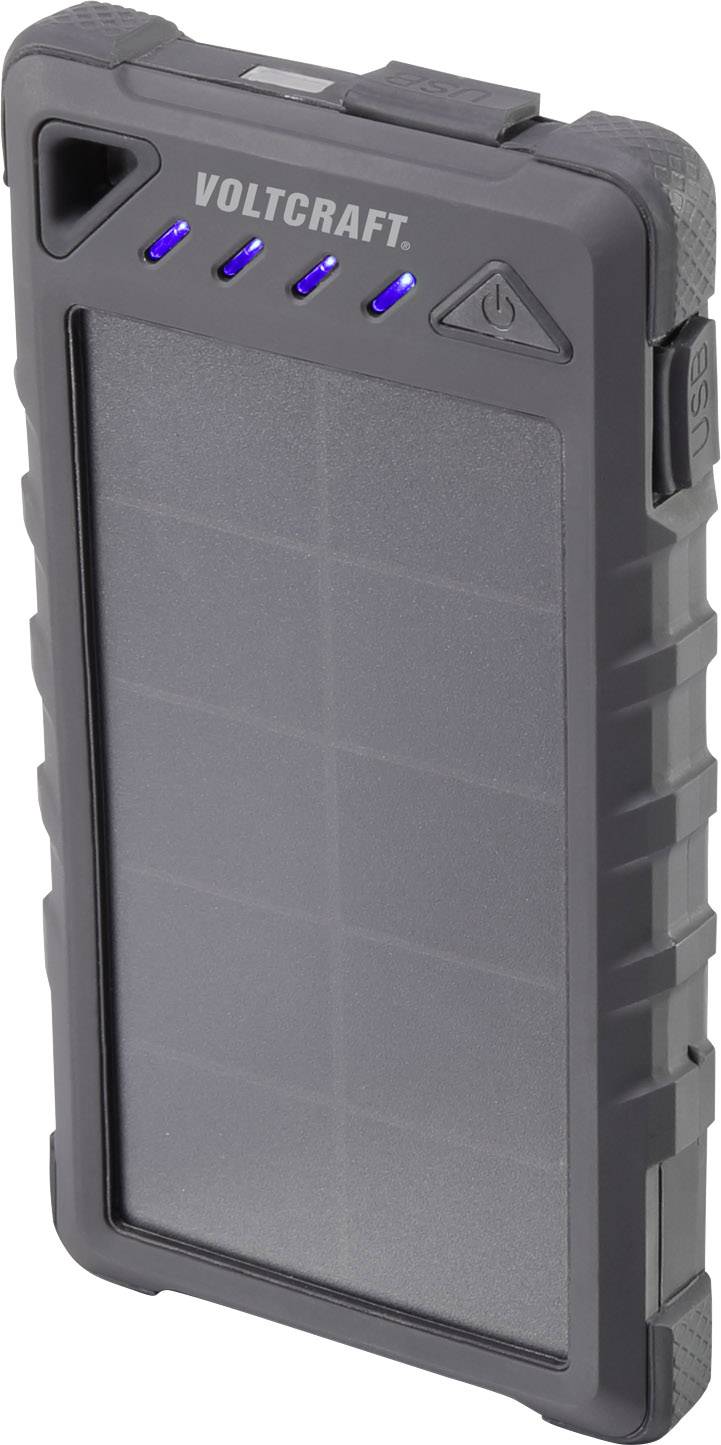 Une batterie externe noire et rectangulaire de la marque Voltcraft, équipée d'un panneau solaire et de quatre voyants LED bleus indiquant le niveau de charge.