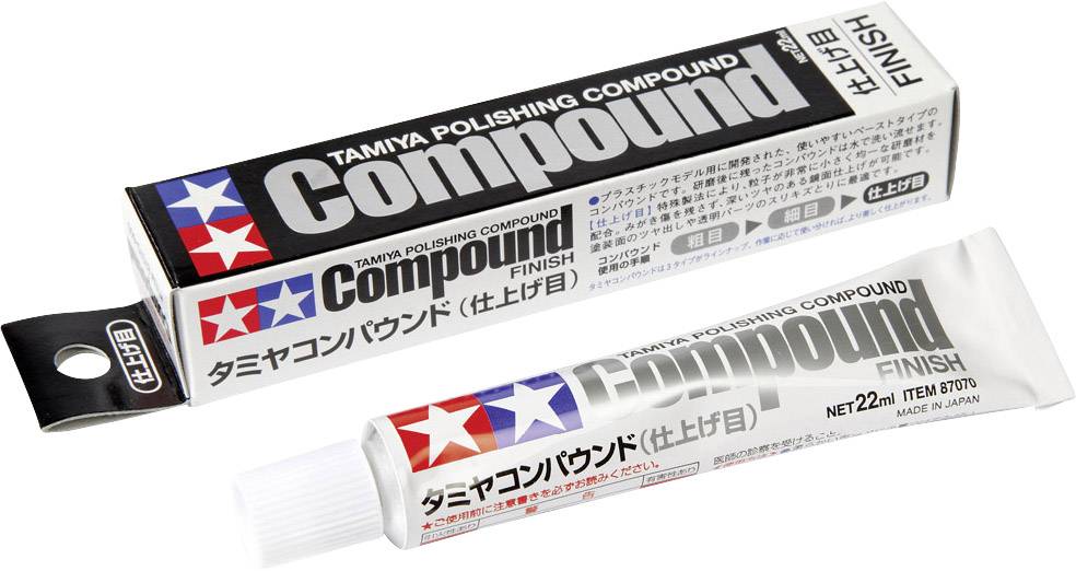 Pâte de polissage Tamiya en tube avec boîte, portant tous deux l'étiquette 'Compound Finish', idéale pour la finition de surface de maquettes.