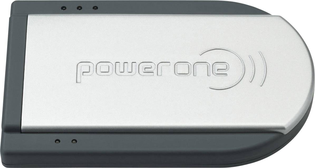 L'image montre un chargeur argenté portant l'inscription 'power one' avec un bord droit arrondi. Il dispose de deux petites lampes témoins.