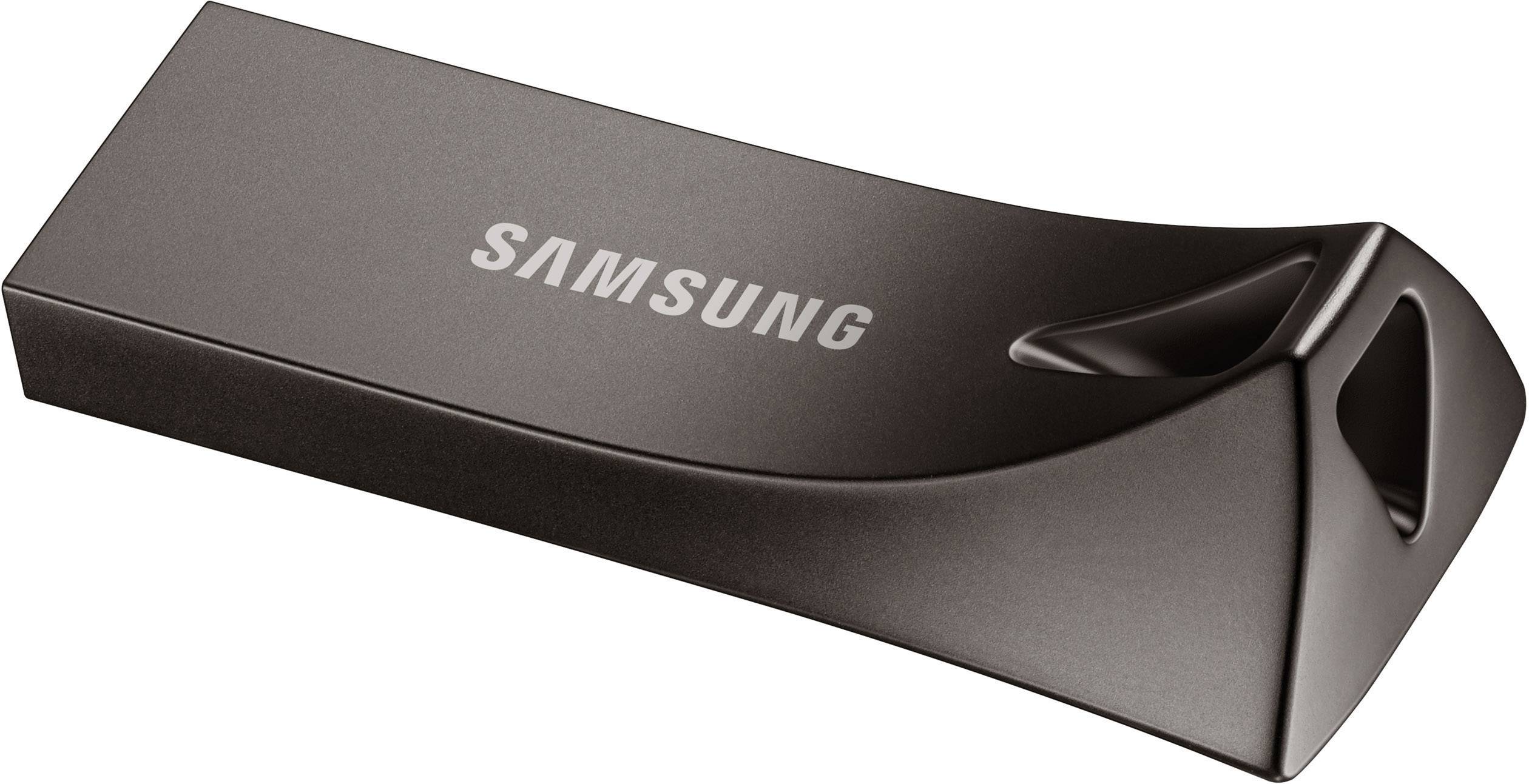 Une clé USB noire avec le logo 'Samsung' dessus, surface légèrement brillante, design moderne et compact.