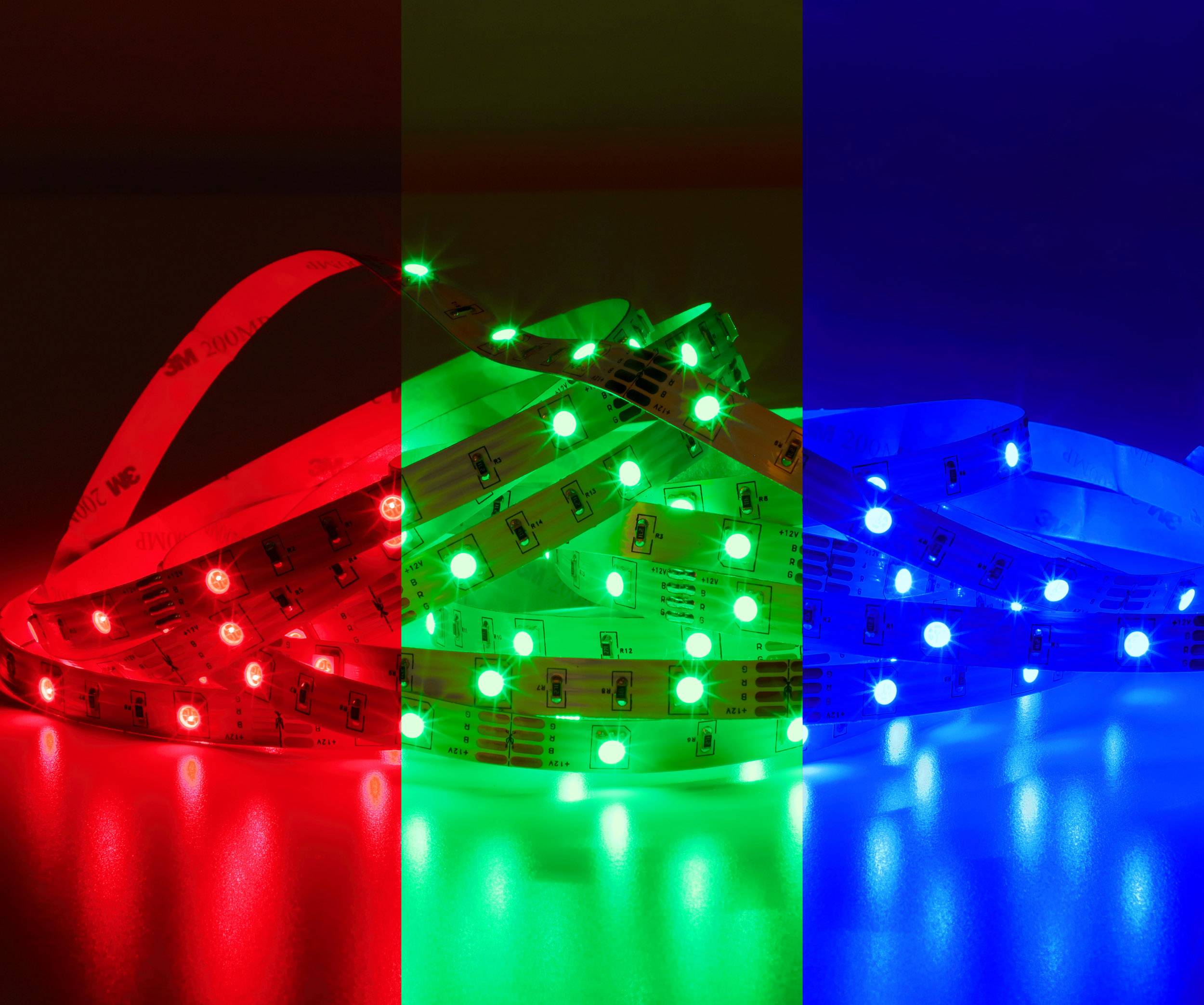 Plusieurs bandes de LED s'illuminent dans les couleurs rouge, vert et bleu, chaque bande affichant une couleur différente et reposant sur une surface.