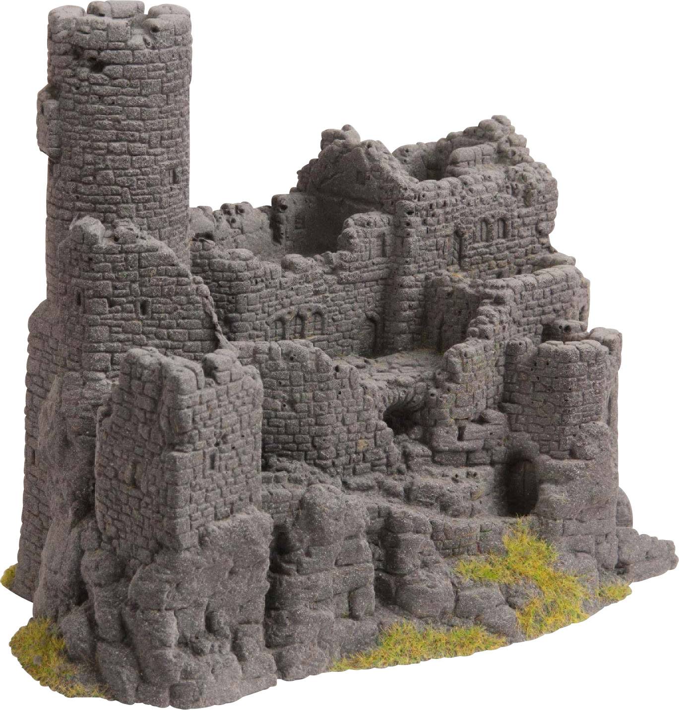 Une miniature grise d'une ruine de château médiéval avec une tour ronde et des murs qui s'effritent, partiellement recouverts de mousse.
