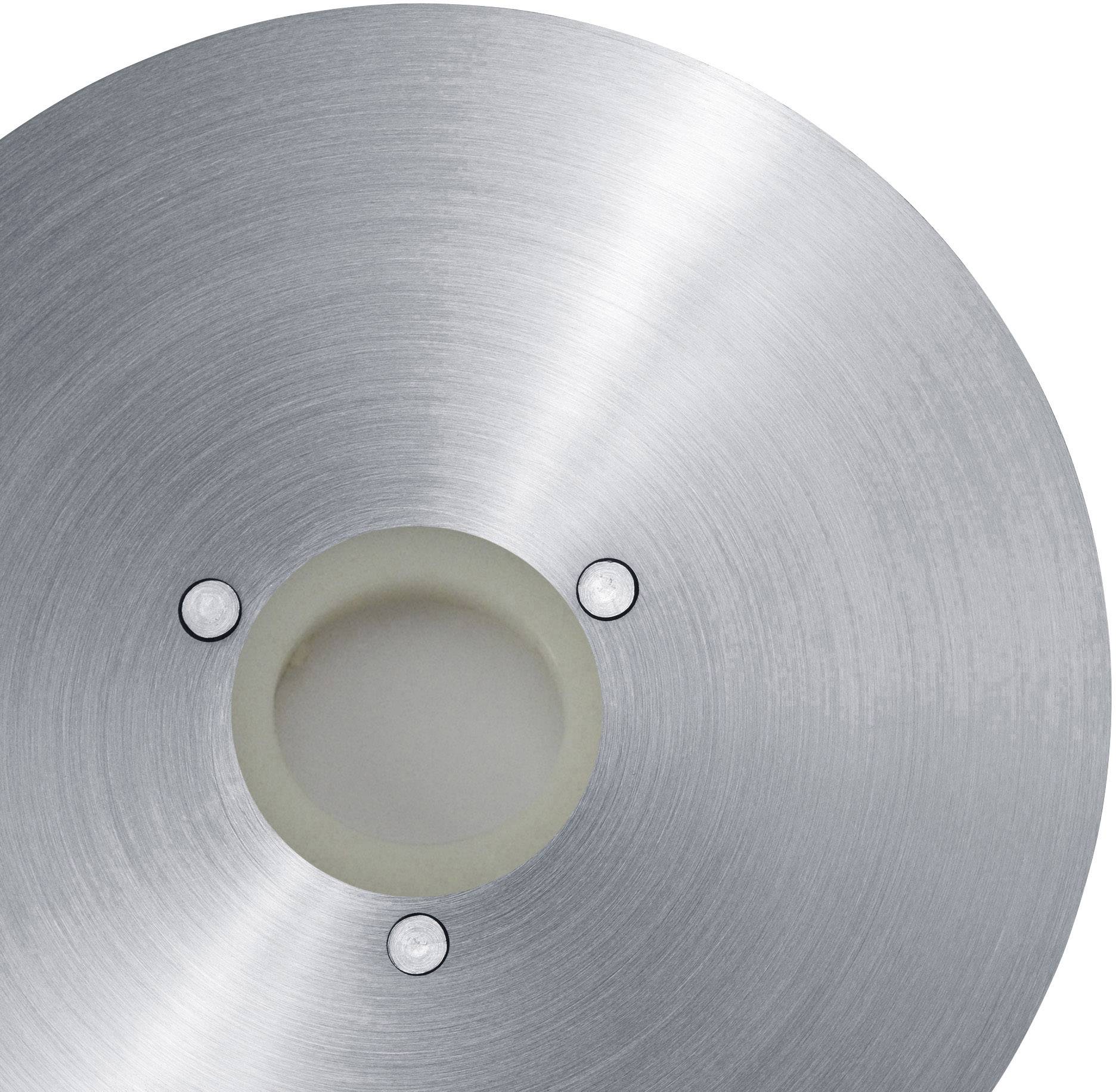 Cercle métallique gris avec un centre blanc et trois trous de vis répartis uniformément, probablement une pièce de machine.