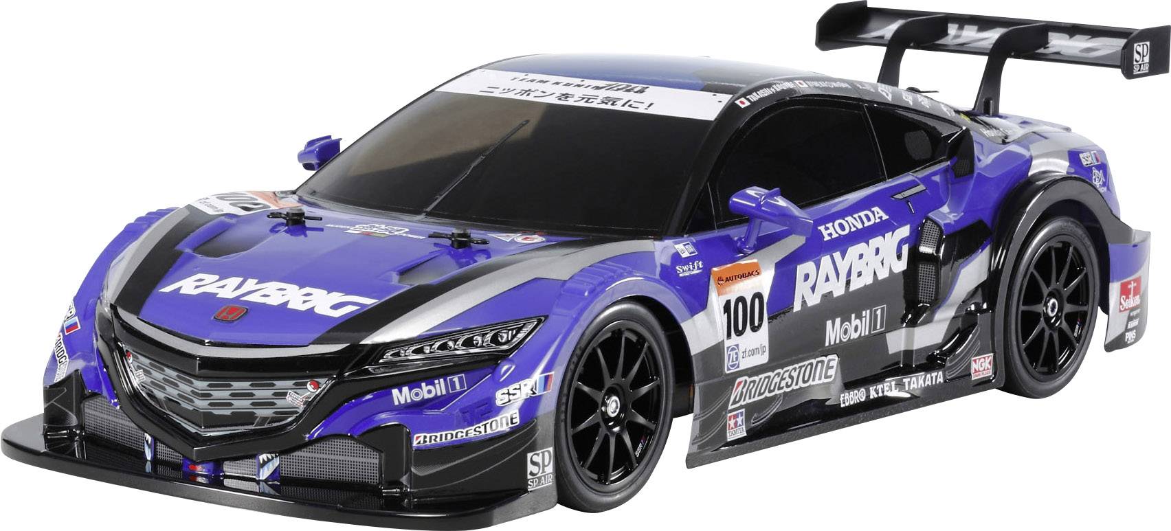 Une voiture de course bleue avec différents logos de sponsors, notamment 'RAYBRIG' et 'Honda', sur une surface blanche.