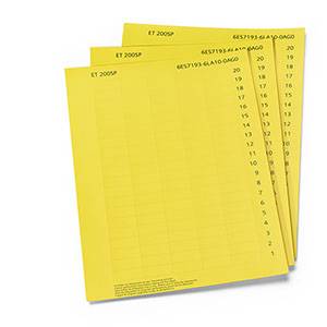 Papier à musique jaune avec des notes de musique et des symboles imprimés. Contient les inscriptions 'ET 2000SP'.