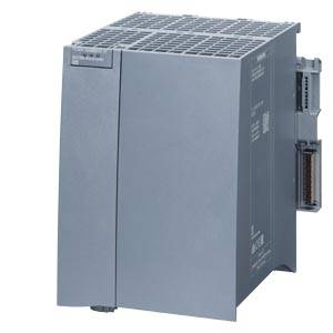 Appareil électronique gris en forme de cube, probablement un module de commande industriel. Il possède des connexions sur le côté droit.