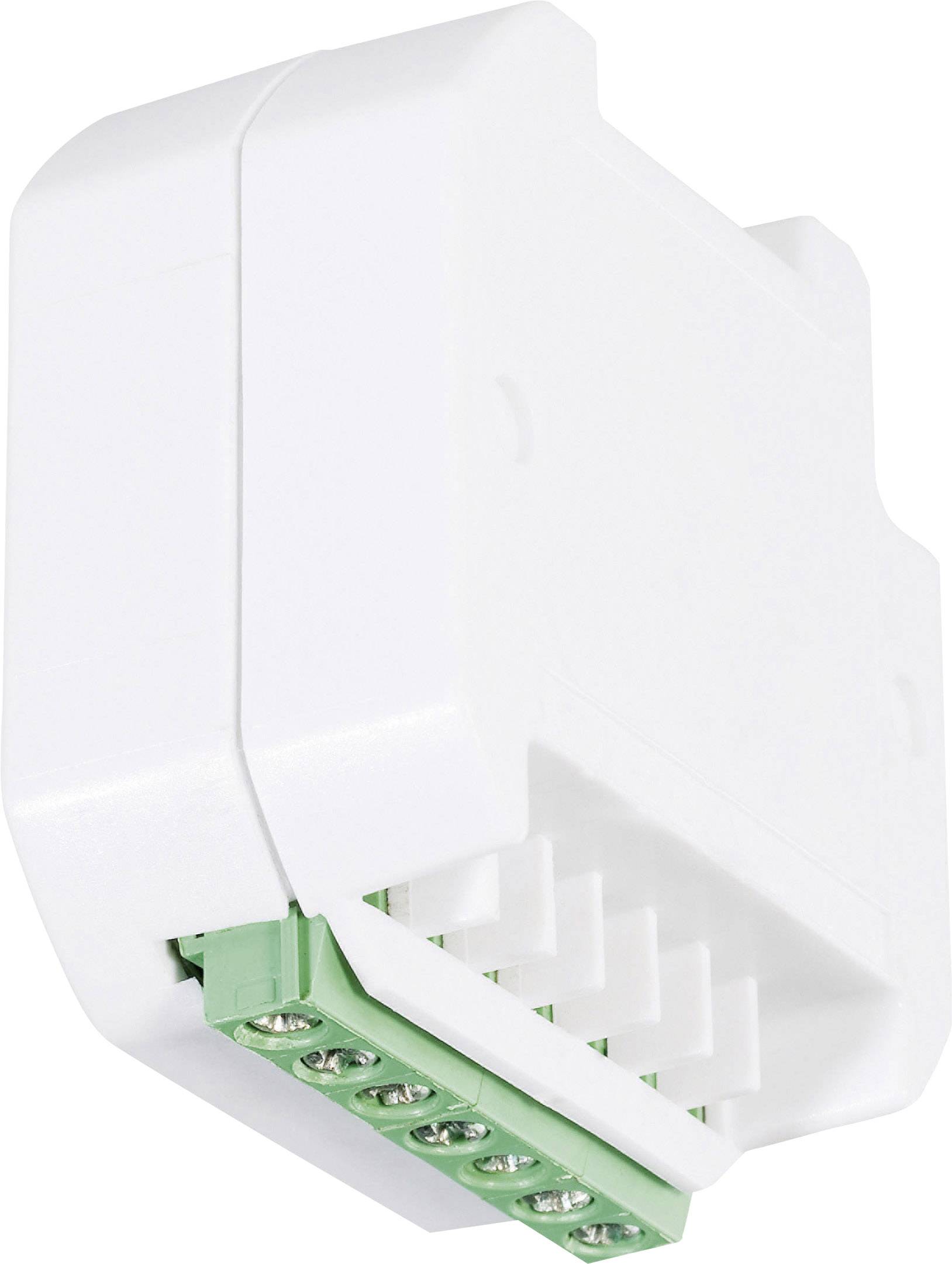 Appareil électrique blanc rectangulaire avec des bornes de connexion vertes, probablement utilisé pour le contrôle ou la connexion de câbles.