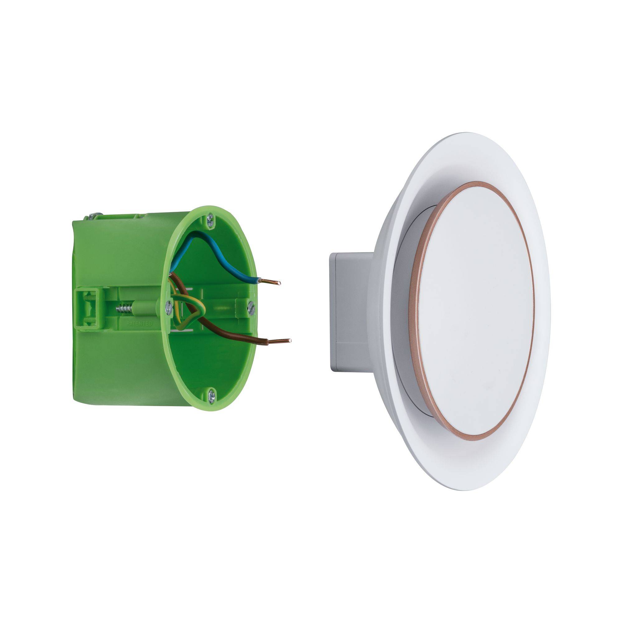 Boîte d'encastrement ronde verte à côté d'un interrupteur circulaire blanc avec un anneau brun, qui dépasse du mur.