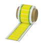 Rouleau d'étiquettes jaunes avec des autocollants rectangulaires empilés.