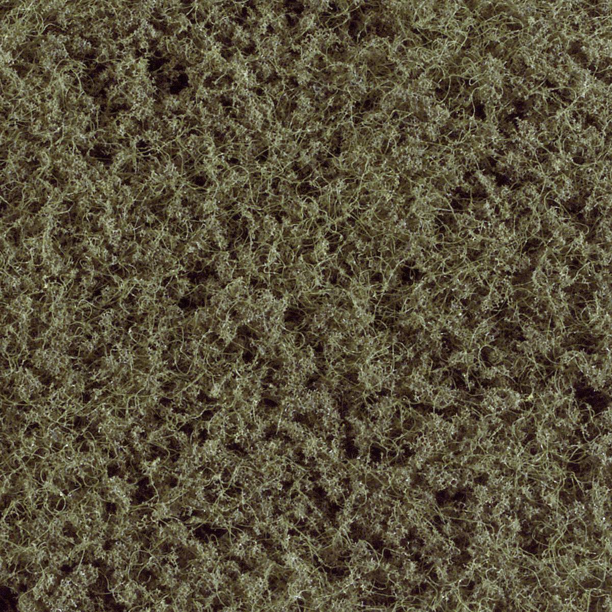 Un gros plan d'une texture dense et emmêlée de fibres brun foncé. Elle rappelle le motif d'un épais tapis de laine.