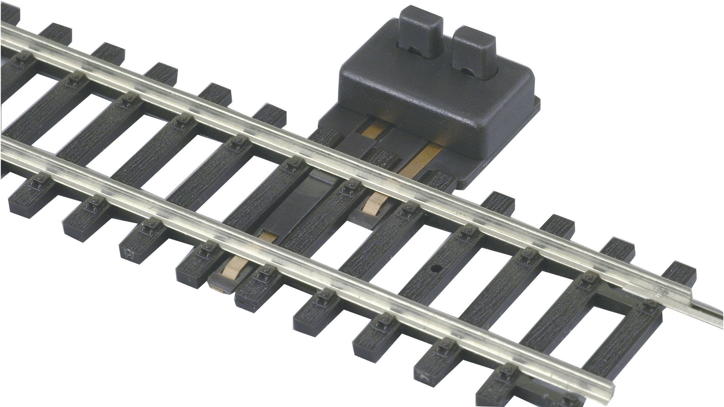 Segment de voie avec circuit électrique pour train miniature. Le module de commutation est placé à l'extrémité du segment de voie.