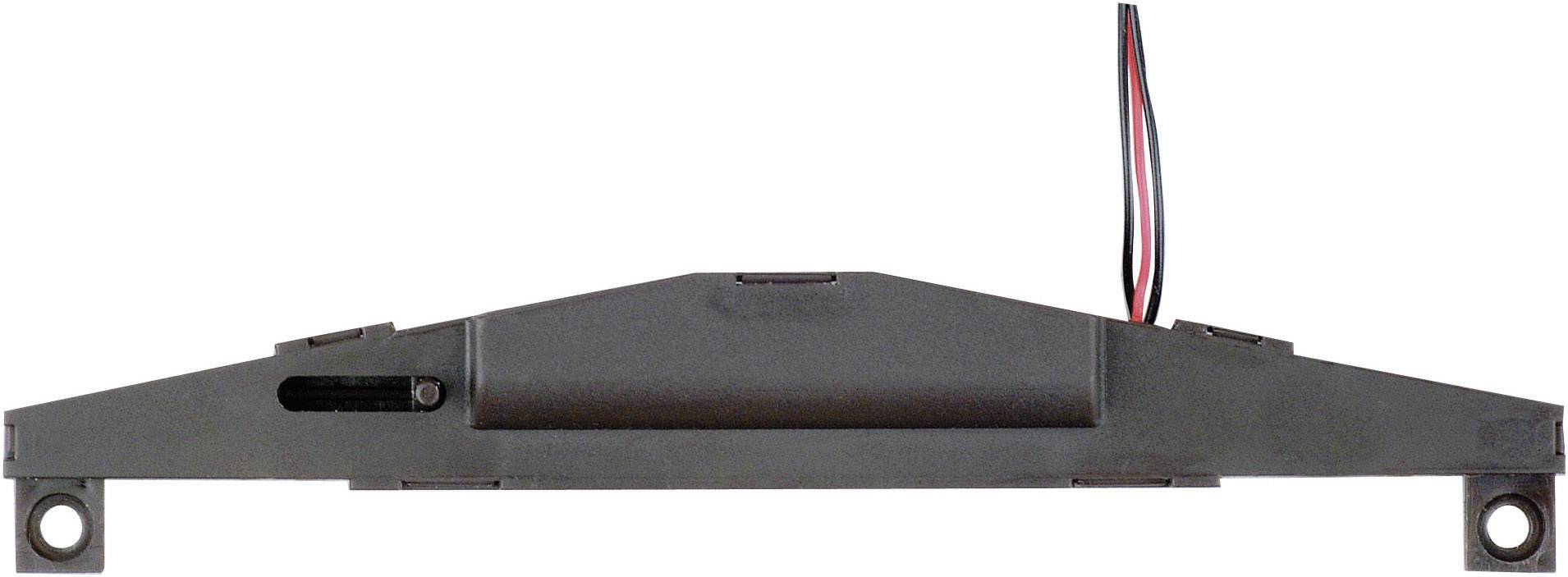 Un haut-parleur rectangulaire avec deux câbles en haut et deux trous de fixation sur les côtés.