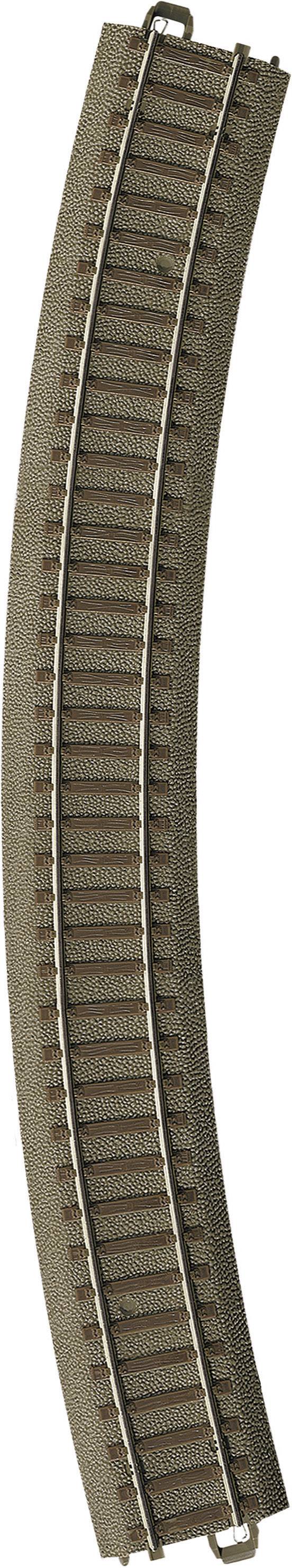 Rail de chemin de fer miniature courbé avec un lit de gravier brun et des rails argentés, adapté pour un paysage ferroviaire miniature.