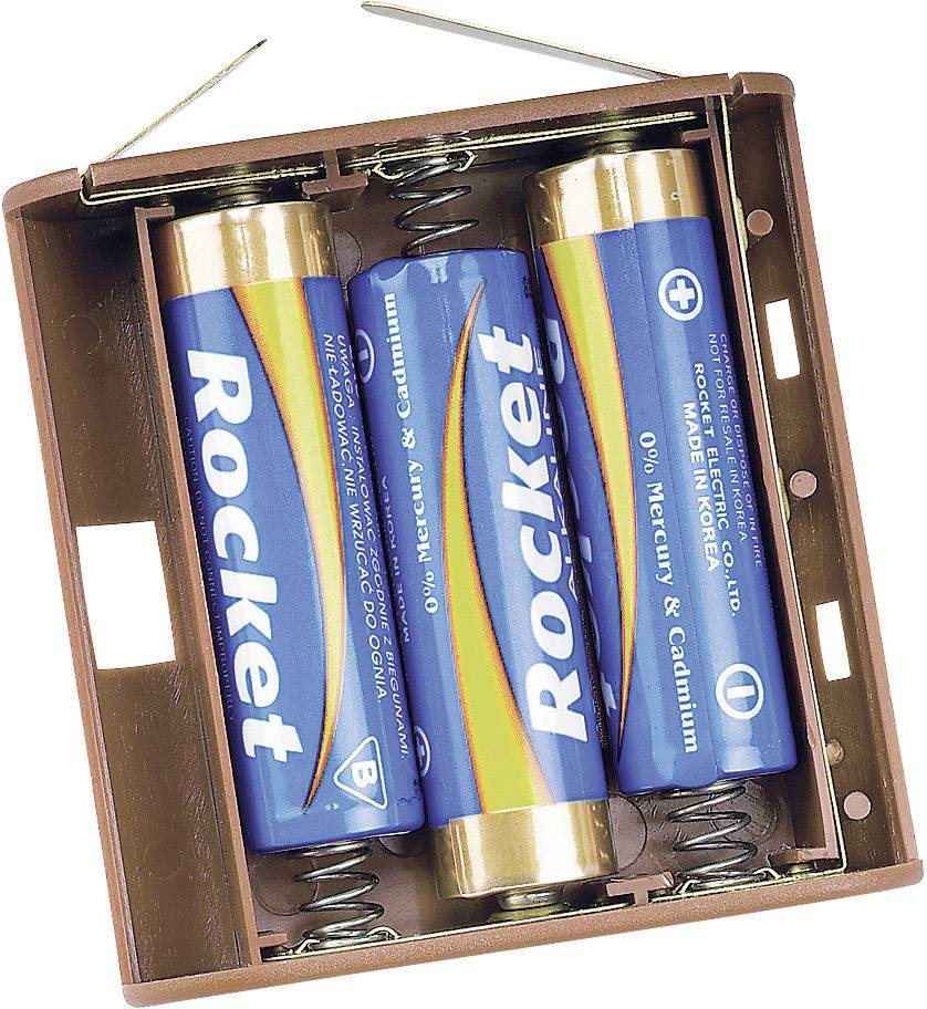 Trois piles AA dans un compartiment à piles marron, chacune avec une étiquette bleue portant l'inscription 'Rocket', maintenues en place par des ressorts.