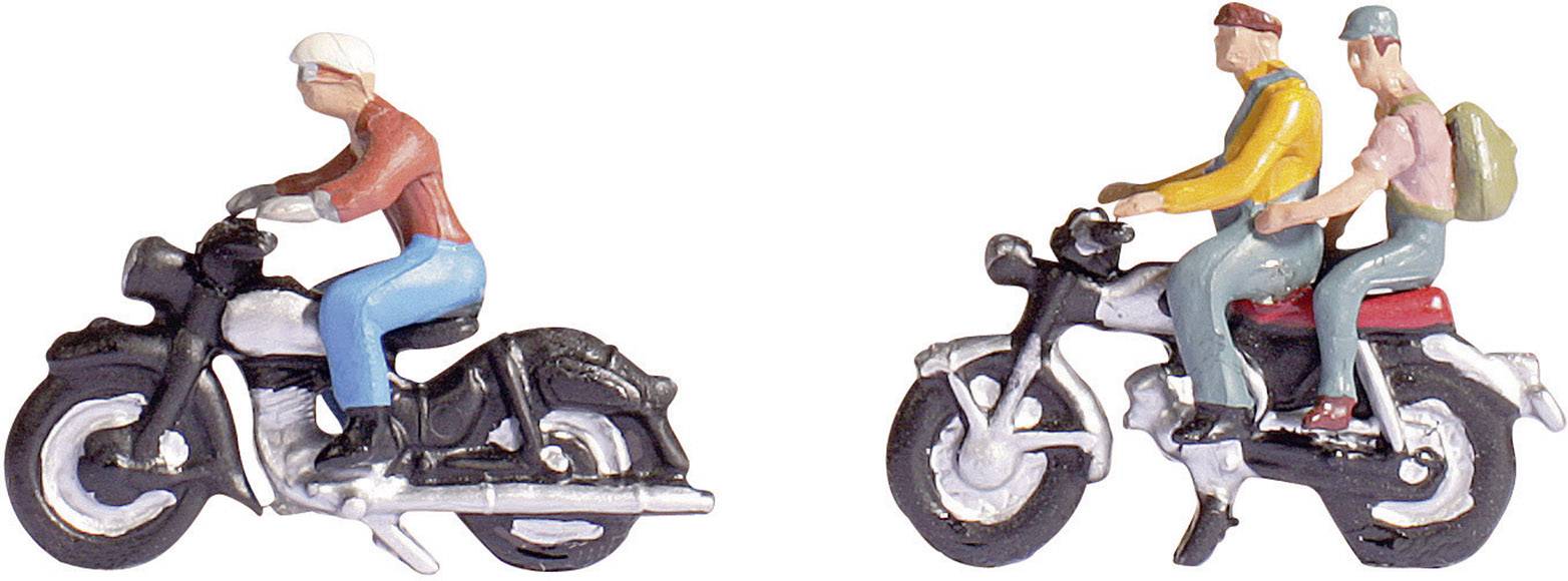 Deux petites figurines sur des motos ; une personne seule sur une moto à gauche, deux personnes sur une moto à droite, l'une portant un sac à dos.