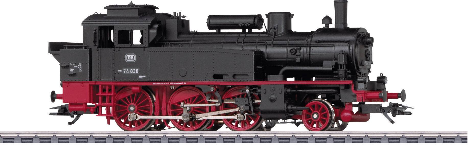 Locomotive à vapeur sur rails, noire avec des détails rouges, vue de côté, datant d'environ 1920. Le modèle de reproduction ferroviaire montre un exemplaire historique de l'industrie.