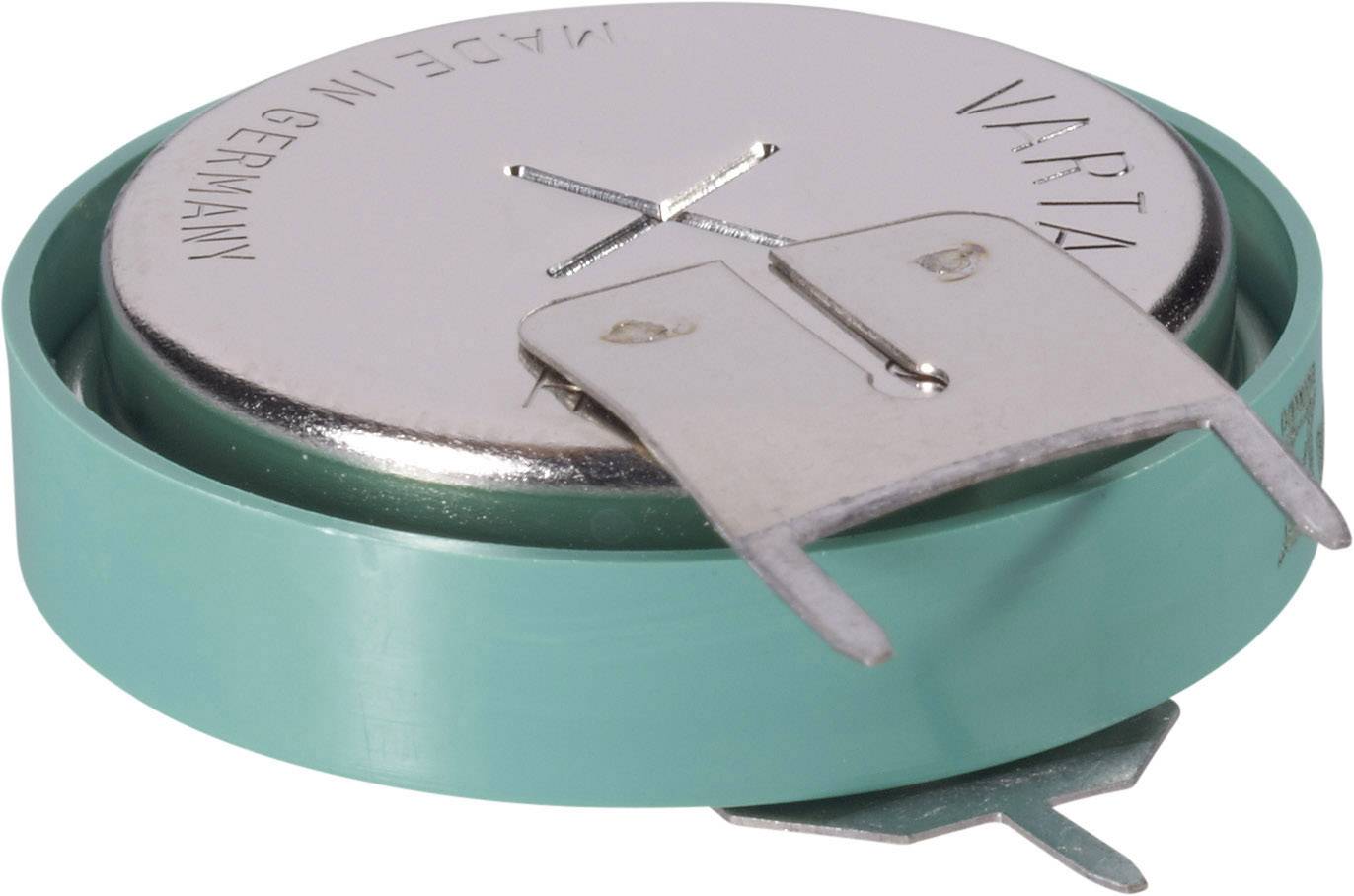 Pile bouton de la marque Varta avec enveloppe verte et deux attaches métalliques pour les contacts.
