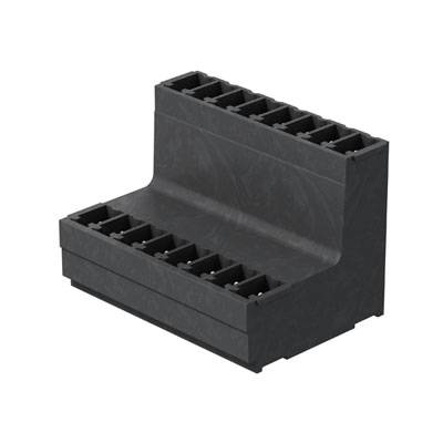 Un connecteur noir en plastique avec plusieurs ports sur sa surface supérieure, adapté pour les circuits électroniques.