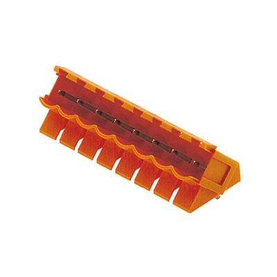 Un morceau de plastique orange avec des dents ondulées, qui pourrait être un composant d'un appareil de bureau ou d'un outil.